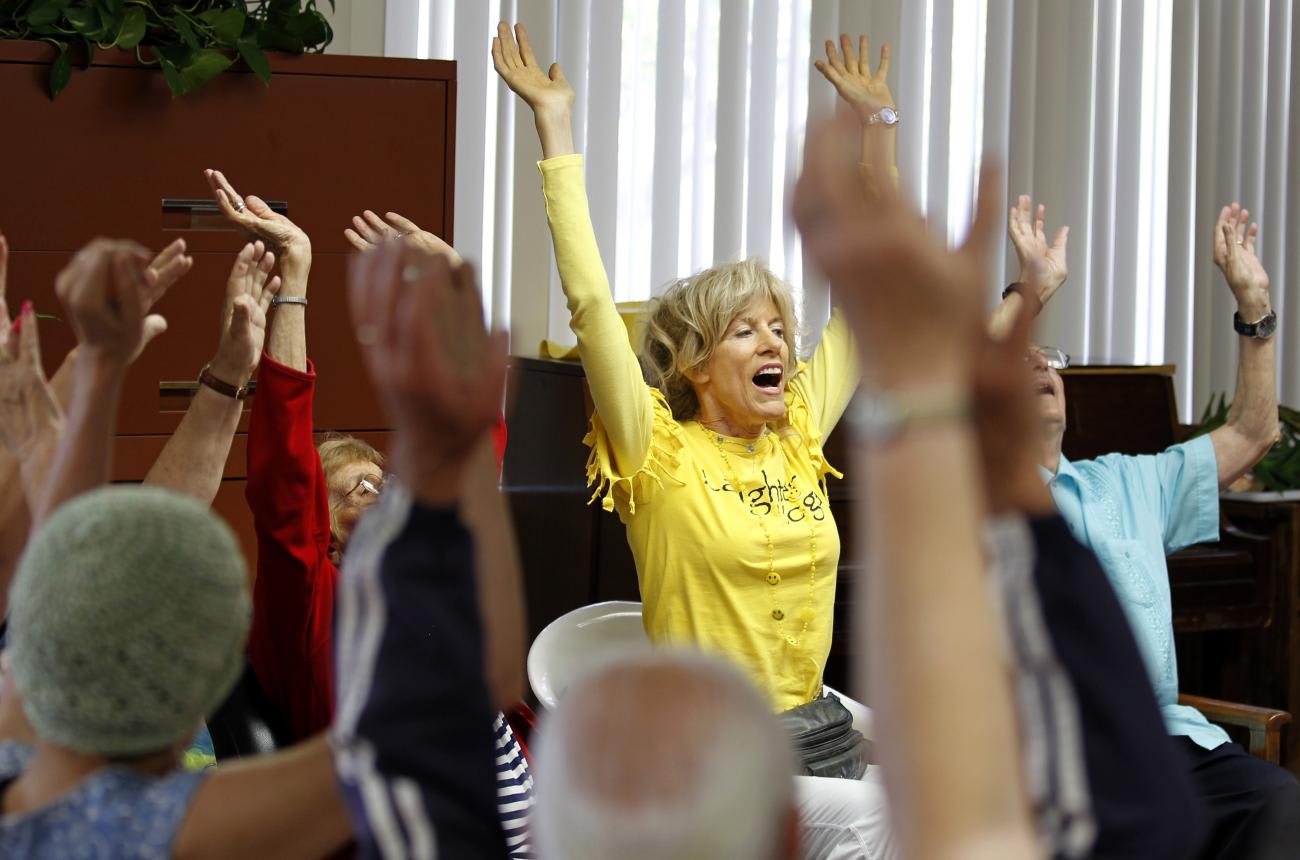Dr. Funshine, aka Caroline Meeks, MD, teaches a laughter therapy class to a group of seniors, at the Clairmont Friendship Center, in San Diego, California, on November 17, 2010.