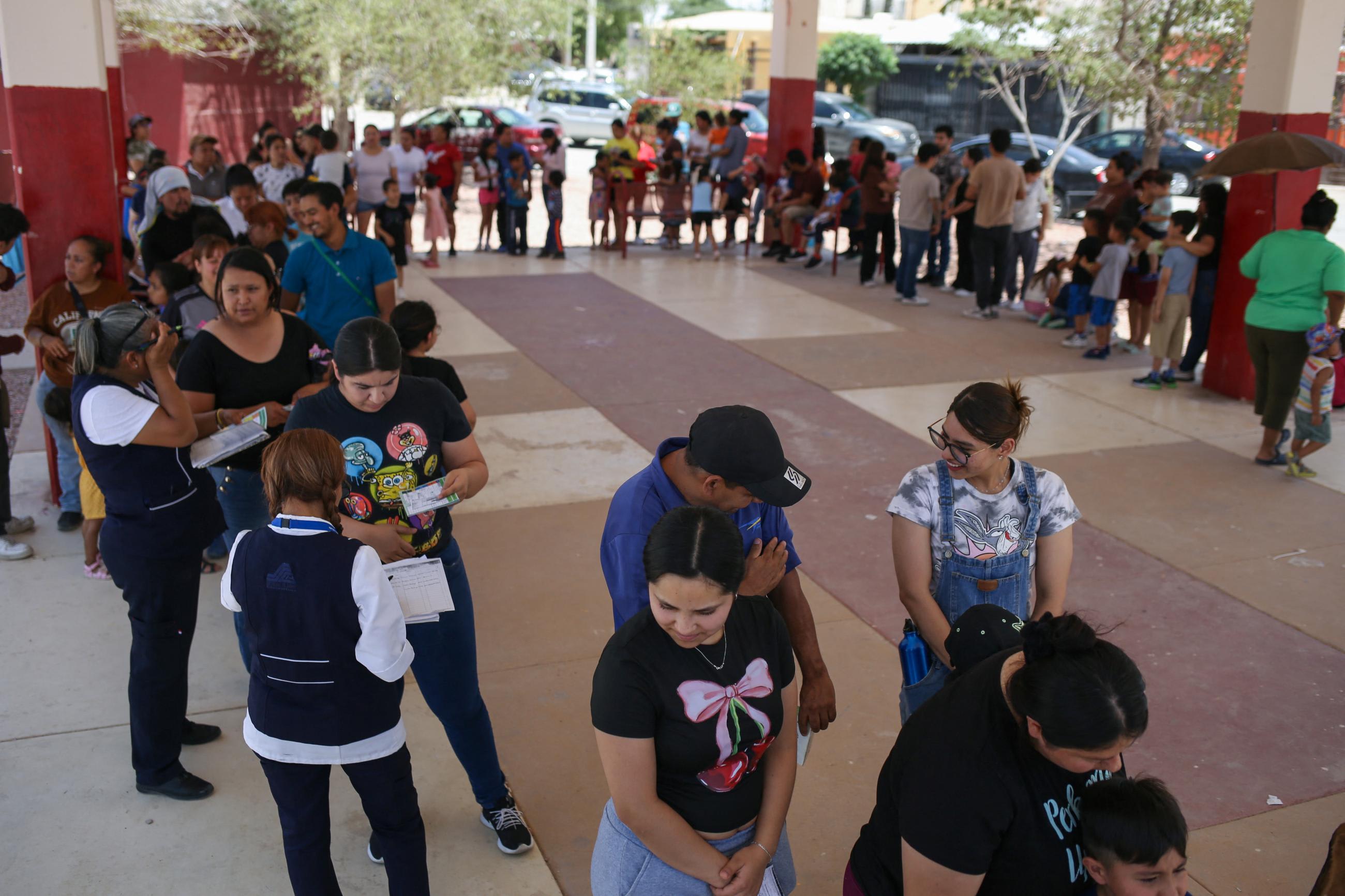 People line up to receive a dose of the measles vaccine during a measles vaccination drive in Ciudad Juarez, Mexico, June 15, 2025.