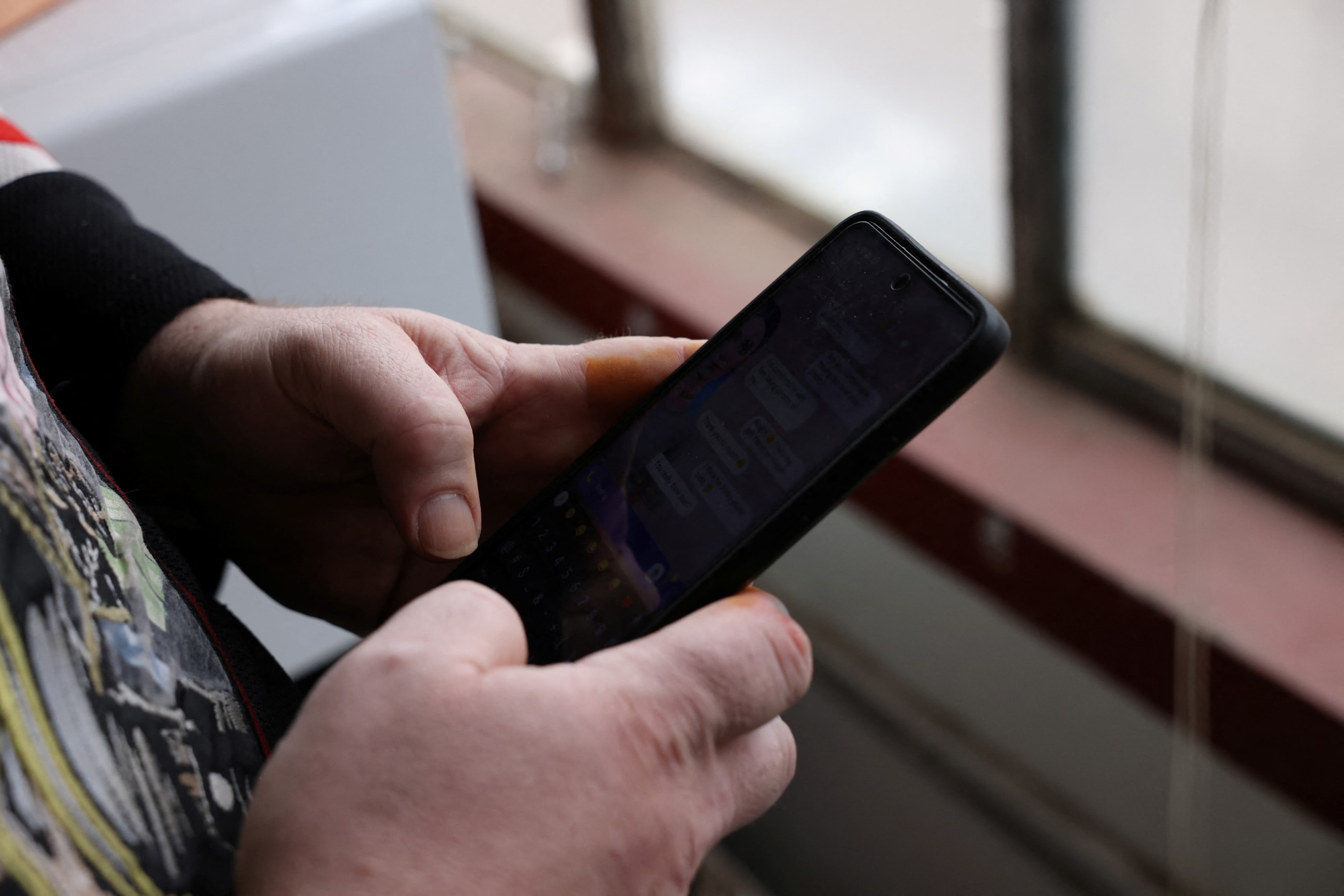 A man messages his AI chat partner, in Denver, Colorado, on March 7, 2023.