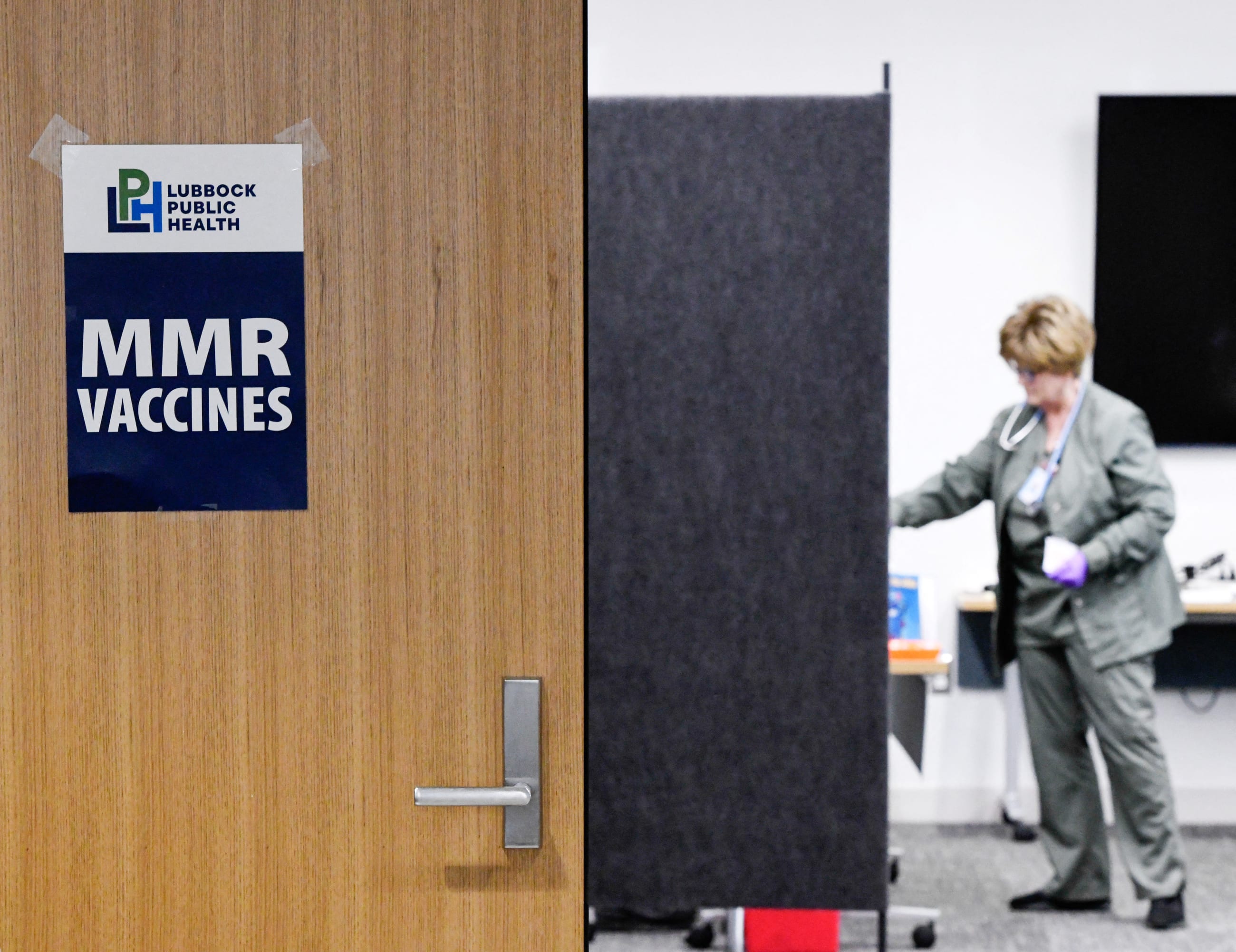 Nurse Sherry Andrews works at the City of Lubbock Health Department as people get the MMR vaccine, in Lubbock, Texas, on February 27, 2025.