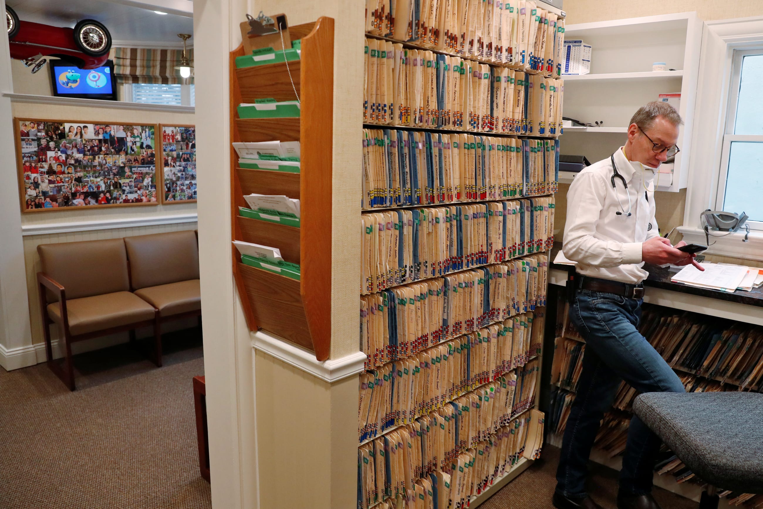 Greg Gulbransen takes part in a telemedicine call with a patient at his pediatric practice, in Oyster Bay, New York, on April 13, 2020.