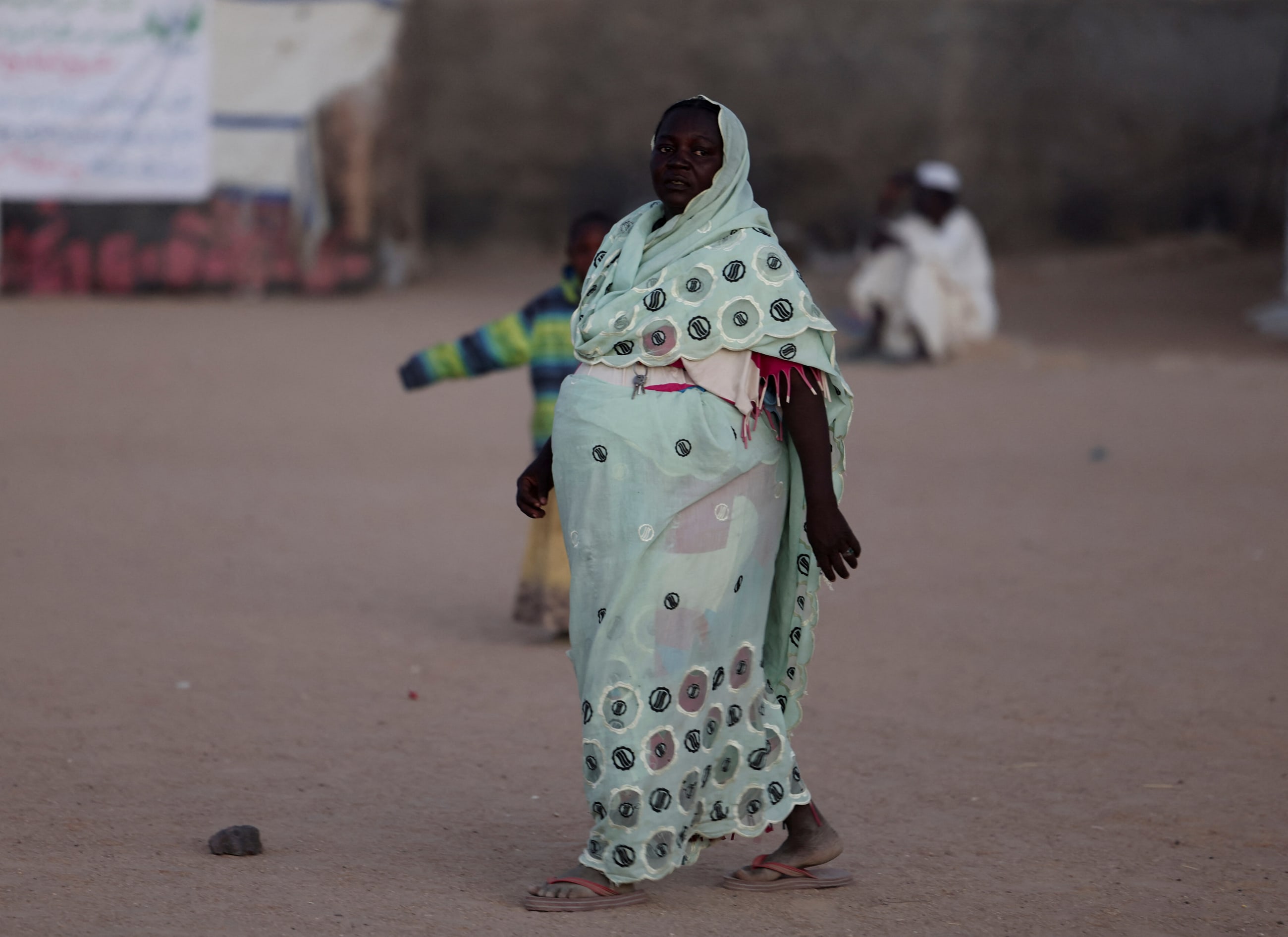 Noura Mohamed Yahya, 38, a nine-month pregnant Sudanese refugee from North Darfur, stands in the Tine transit camp in eastern Chad, on November 22, 2025.