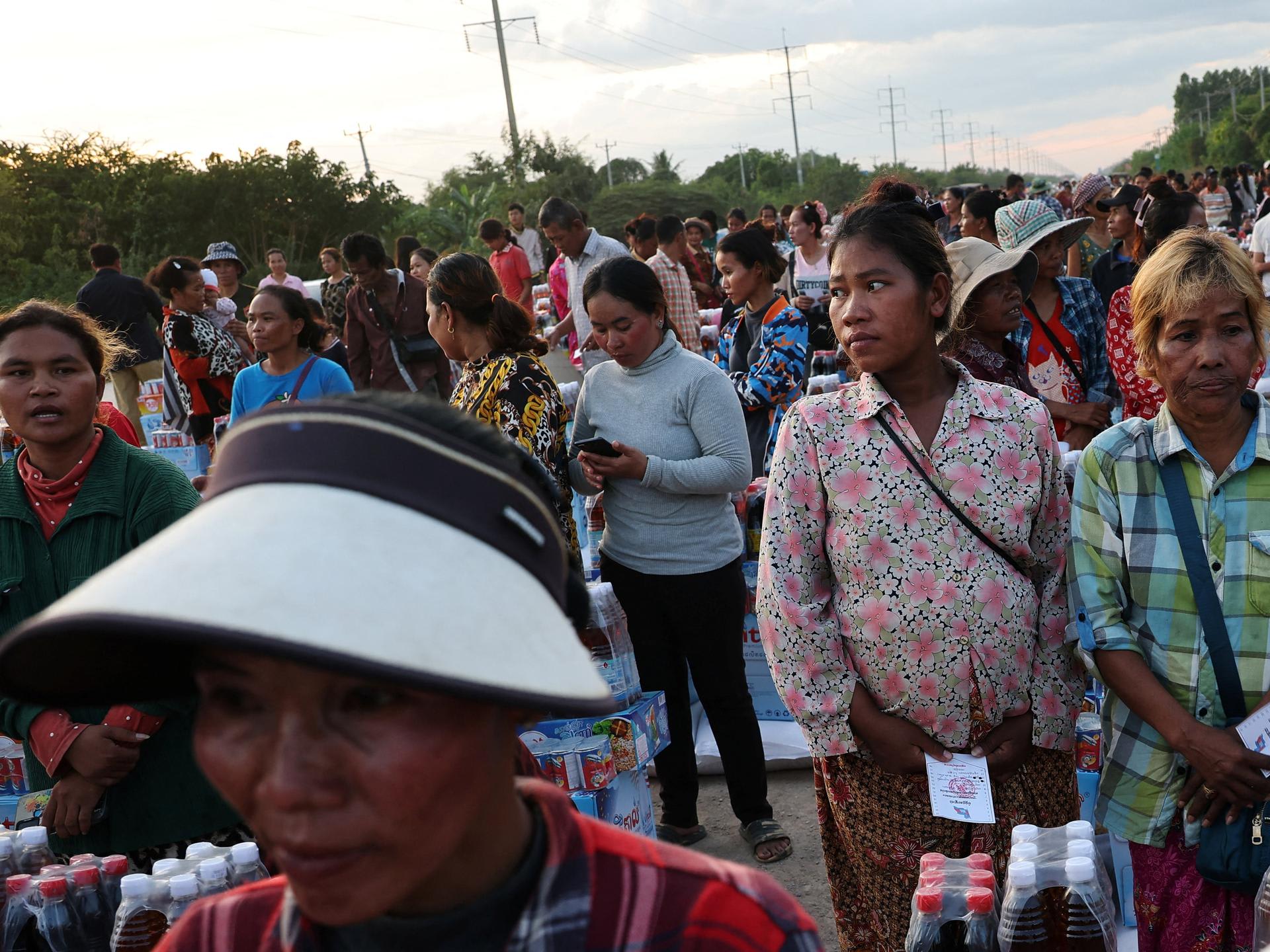 Suang Sreang, 27, who is pregnant and due to give birth within days, waits to receive supplies at Wat Por Sovannaram refugee camp, in Ou Chrov district, Banteay Meanchey Province, Cambodia, on December 13, 2025.