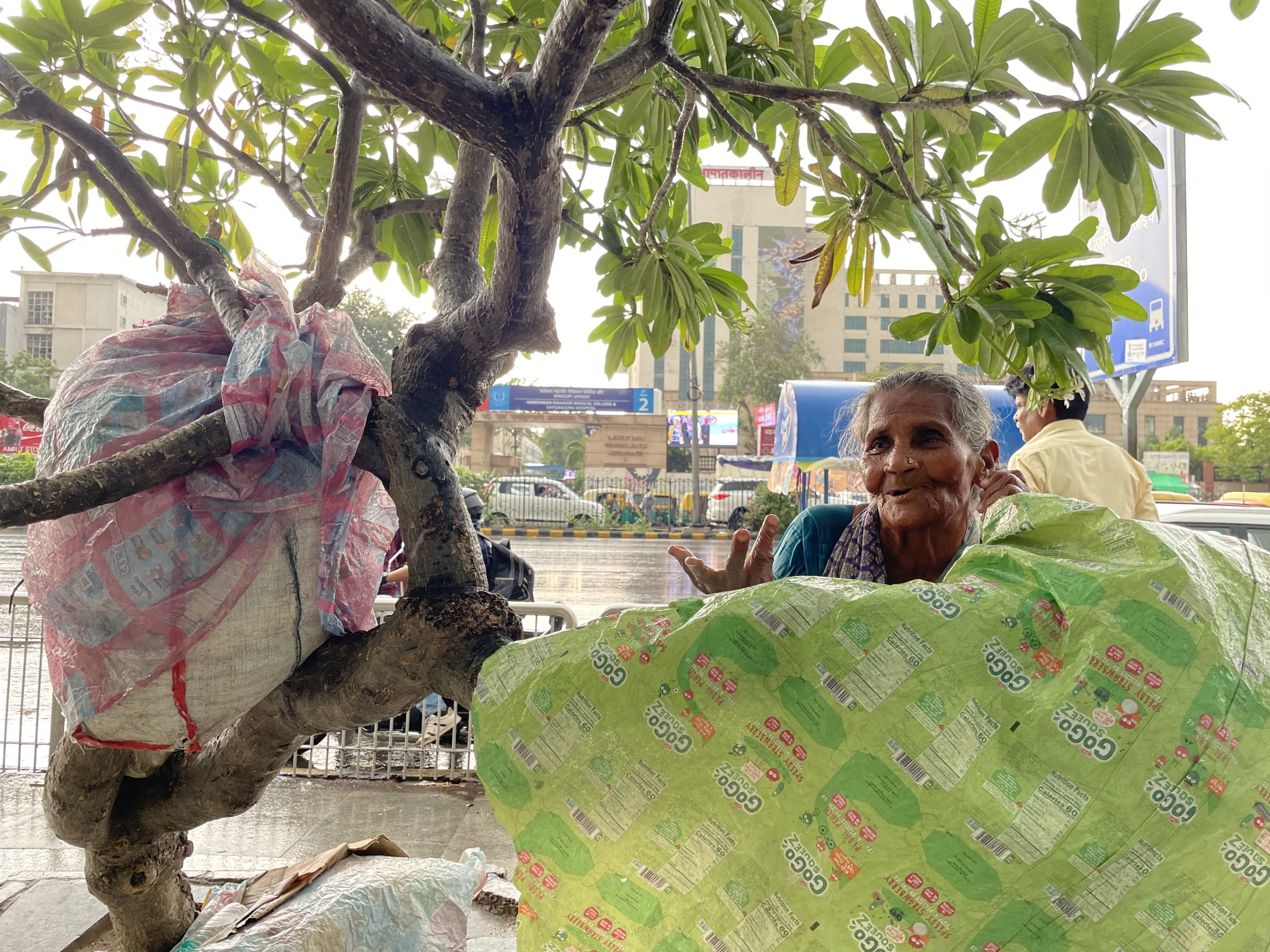 Dayawanti Devi, 62, waits outside AIIMS Delhi hospital in the hope of securing an appointment for tuberculosis treatment, in New Delhi, India, on November 28, 2025.