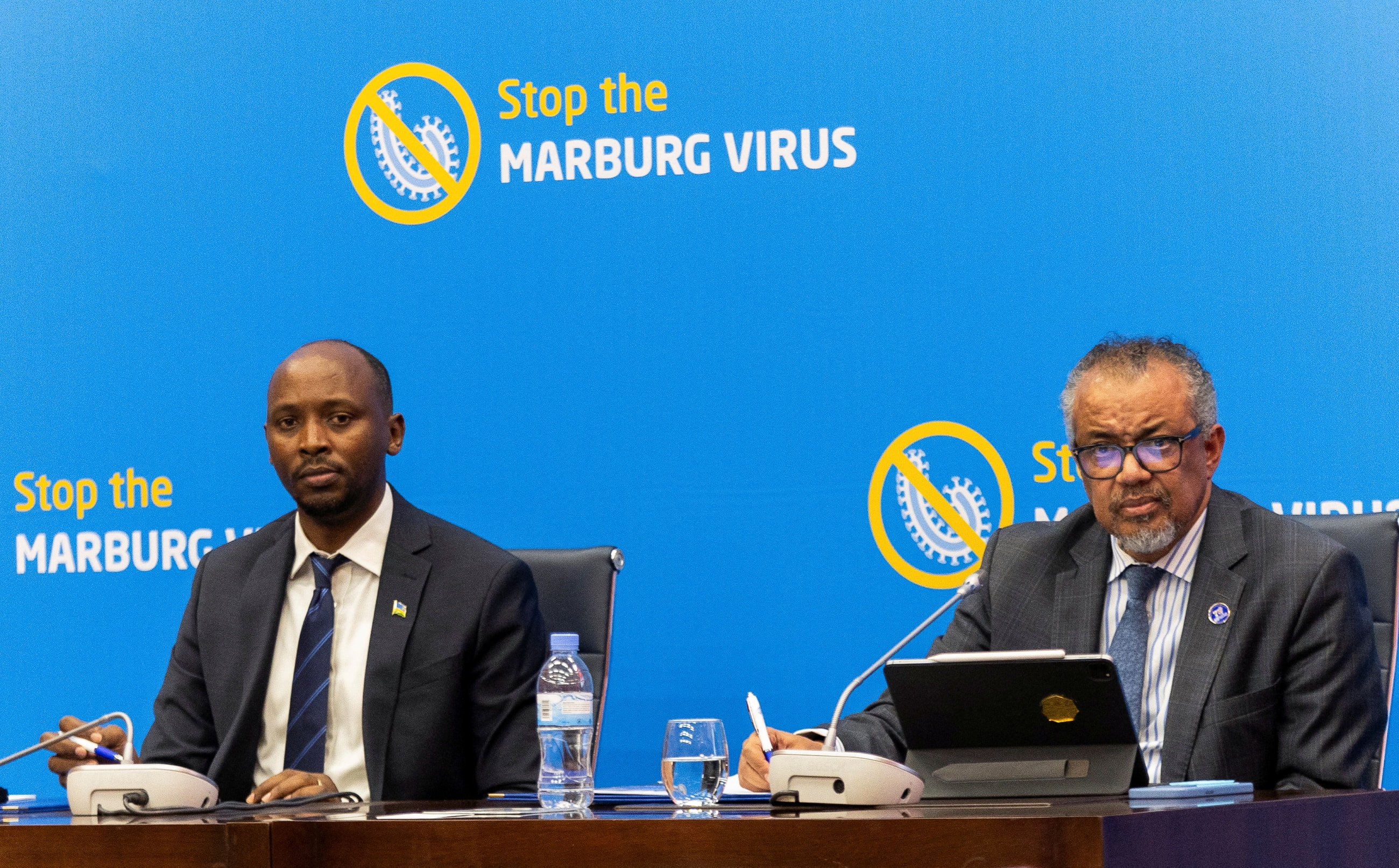 World Health Organization Director-General Tedros Adhanom Ghebreyesus flanked by Rwanda's Minister of Health, Sabin Nsanzimana address a press conference on the Marburg virus outbreak at the Kigali Convention Center in Kigali, Rwanda, October 20, 2024.