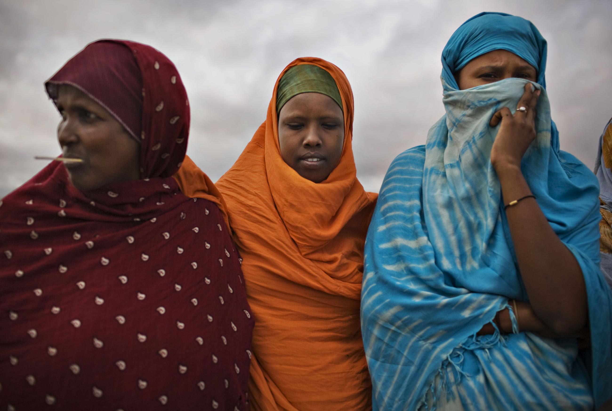 Somali refugee women stand together at Dagahaley camp.