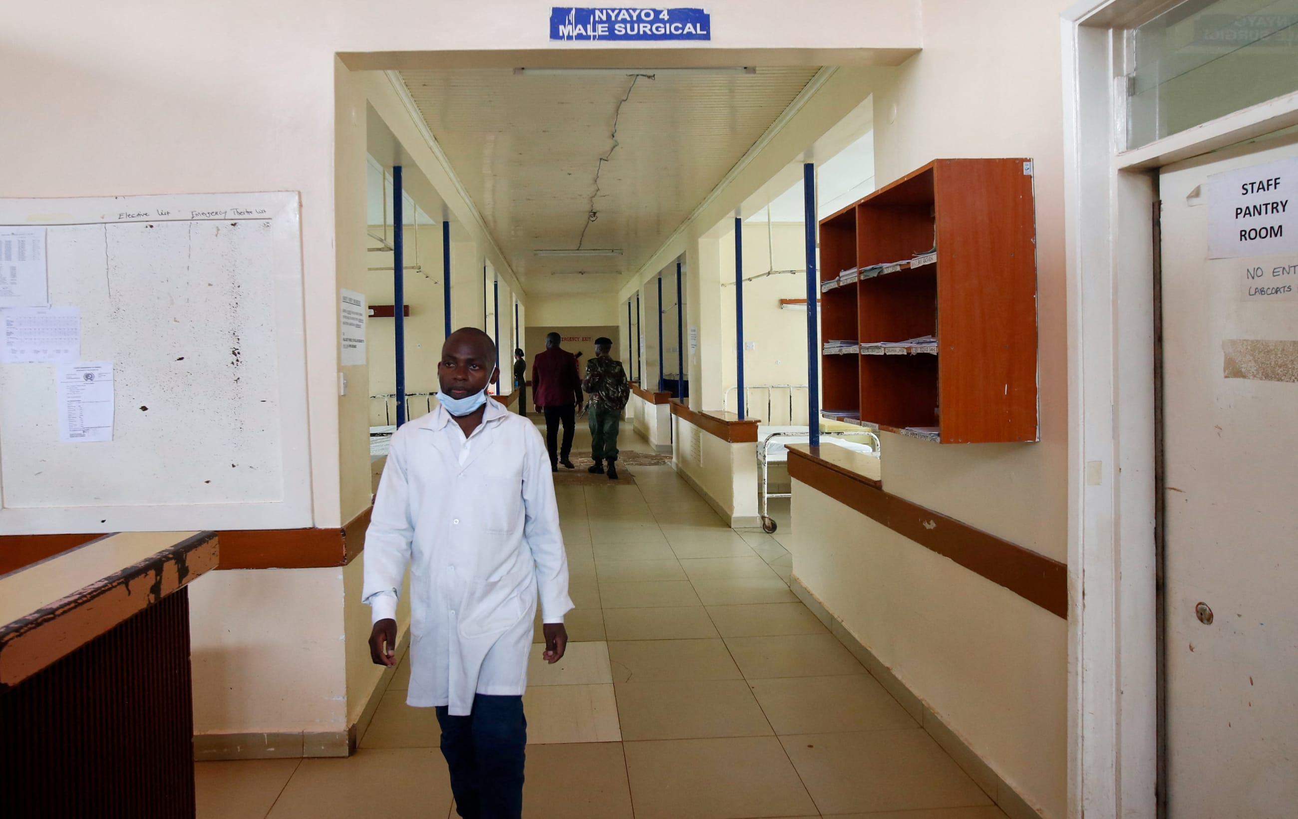 A medical worker walks from the male ward, at the Kiambu Referral Hospital, in Kenya, on April 23, 2024.