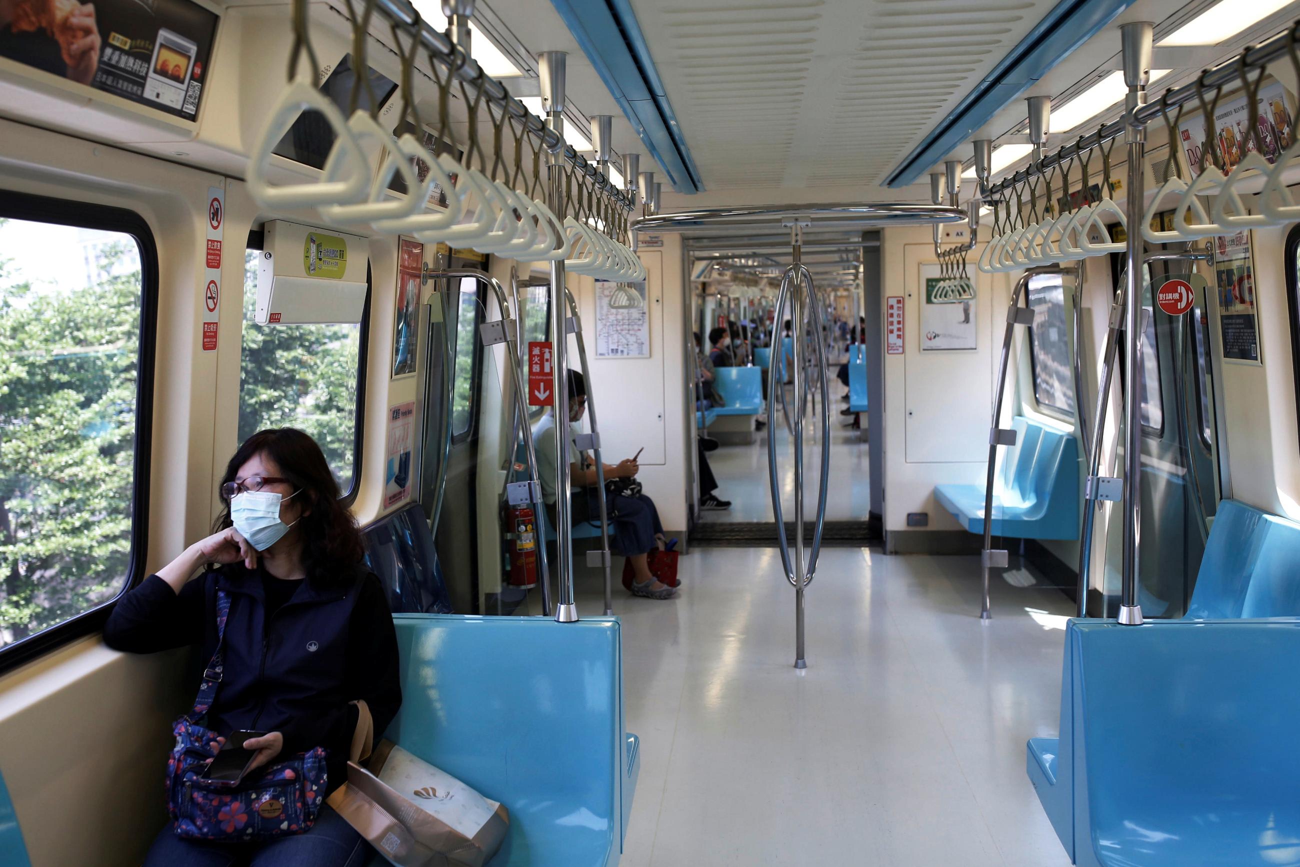 A woman wears a face mask as a mandatory precaution for riding on public transportation amid the coronavirus disease (COVID-19) outbreak, in Taipei, Taiwan, April 30, 2020.