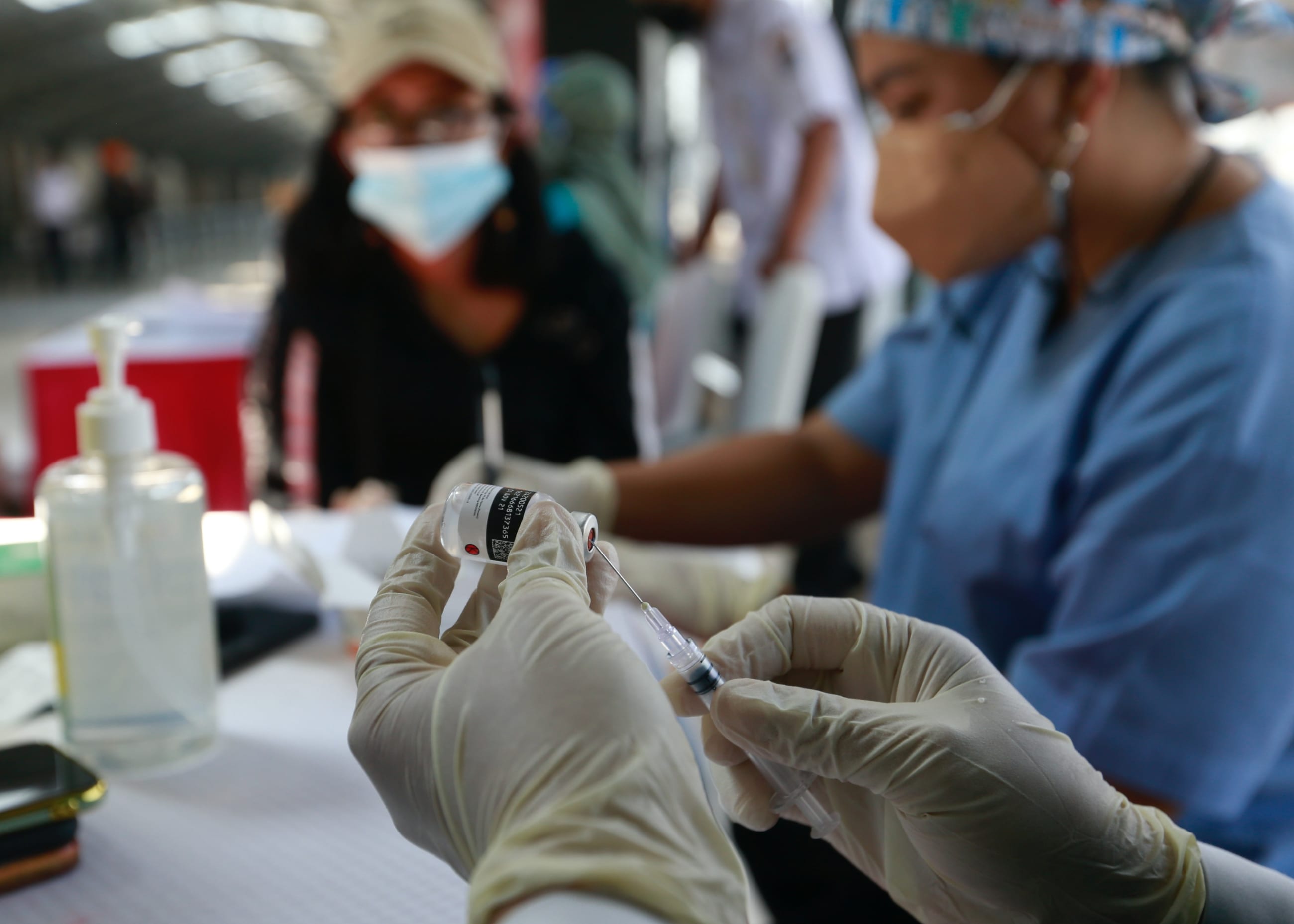 A health-care worker prepares a dose of China's Sinovac Biotech vaccine against COVID-19, in Jakarta, Indonesia, on July 28, 2021.