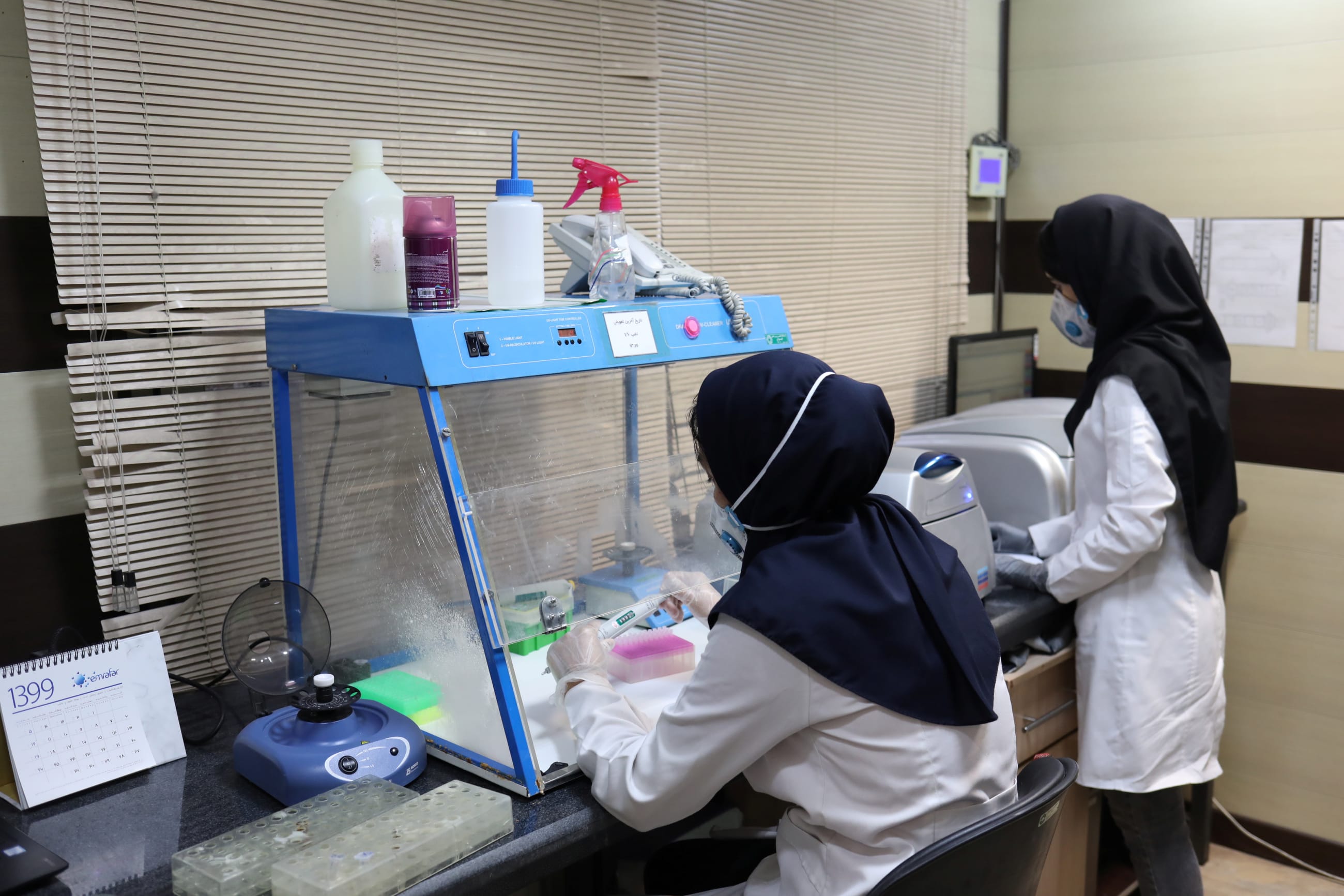 A medical team works inside a lab with COVID-19 testing kits, in Tehran, Iran, on May 20, 2020.