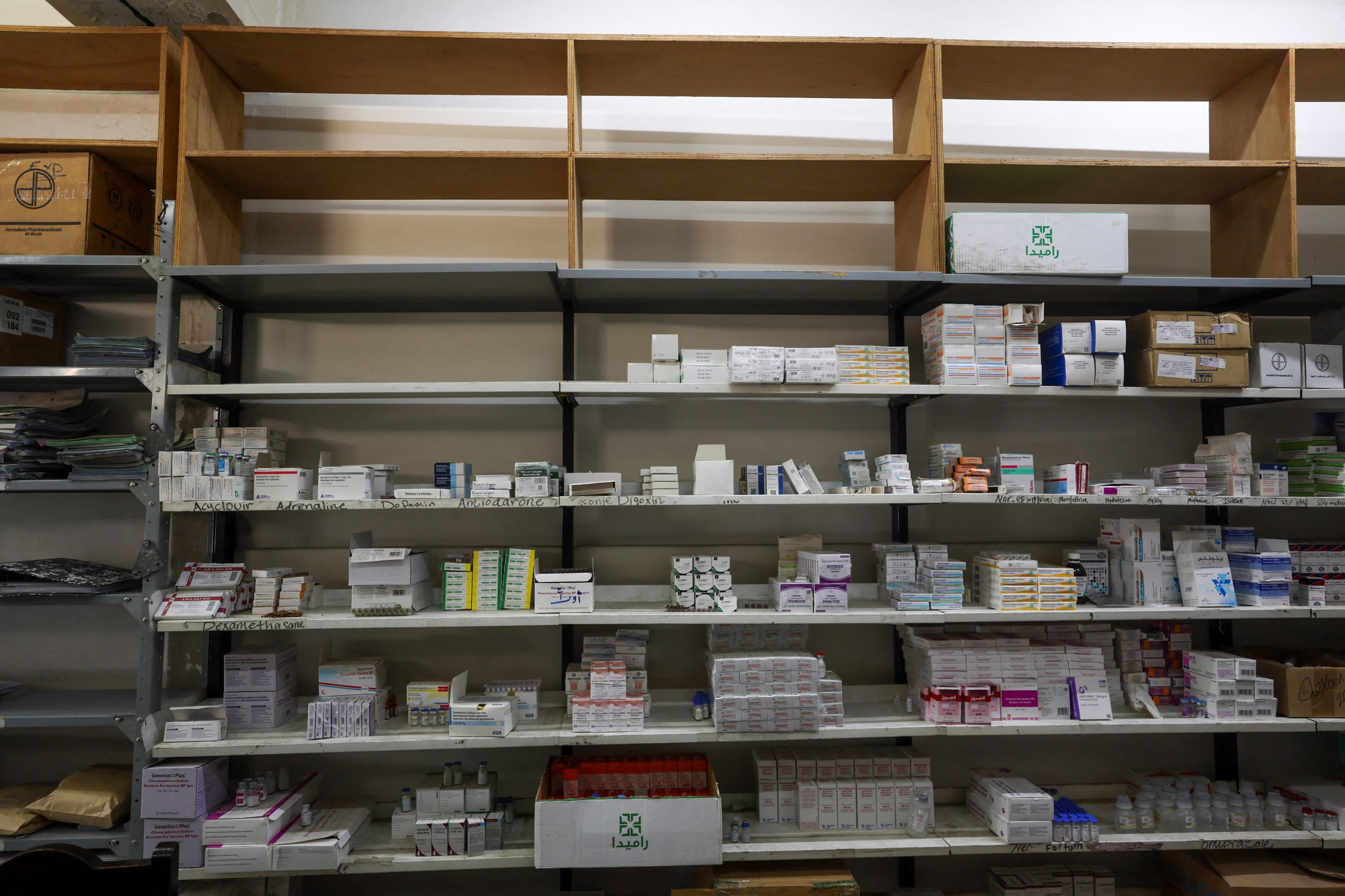 Medicine shelves are seen at Al-Ahli Arab Hospital as medical supplies run critically low, in Gaza City, on March 8, 2026.