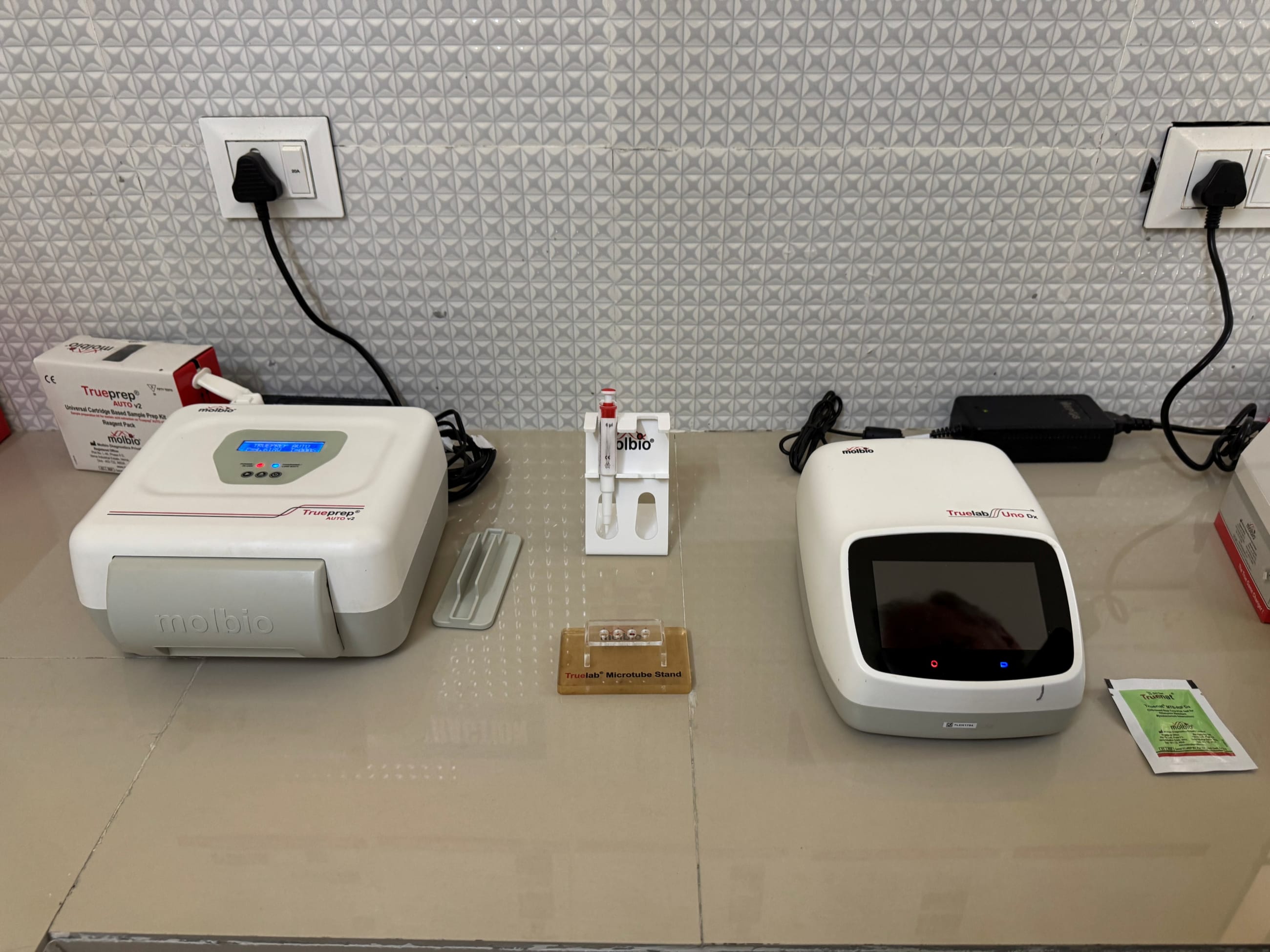 A molecular test for tuberculosis, made by Molbio Diagnostics (left), sits on a table at Dewa Community Health Center, in Uttar Pradesh, India, on February 3, 2025.