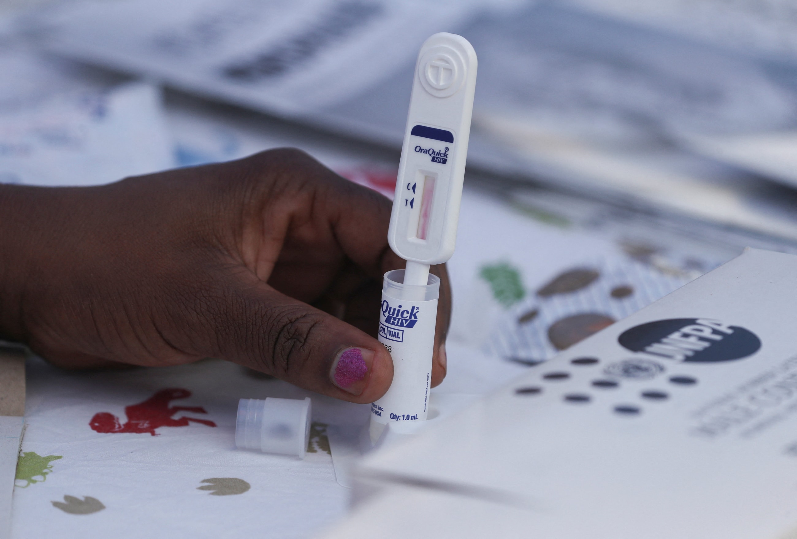 A health official conducts a rapid HIV test during the launch of Lenacapavir, in Epworth, Zimbabwe, on February 19, 2026.