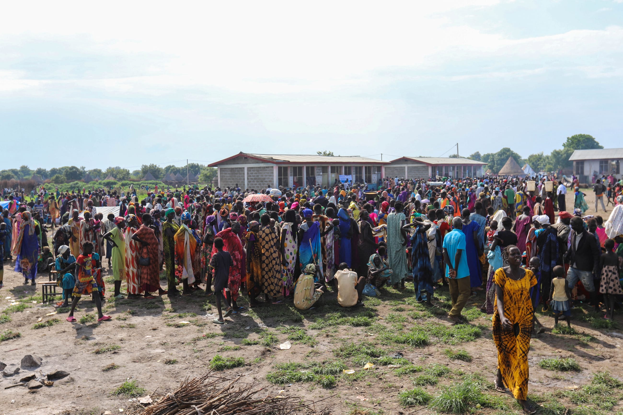 South Sudanese asylum seekers wait to receive fortified biscuits as part of World Food Program food assistance, at the Matar refugee camp, in Ethiopia, on June 12, 2025.
