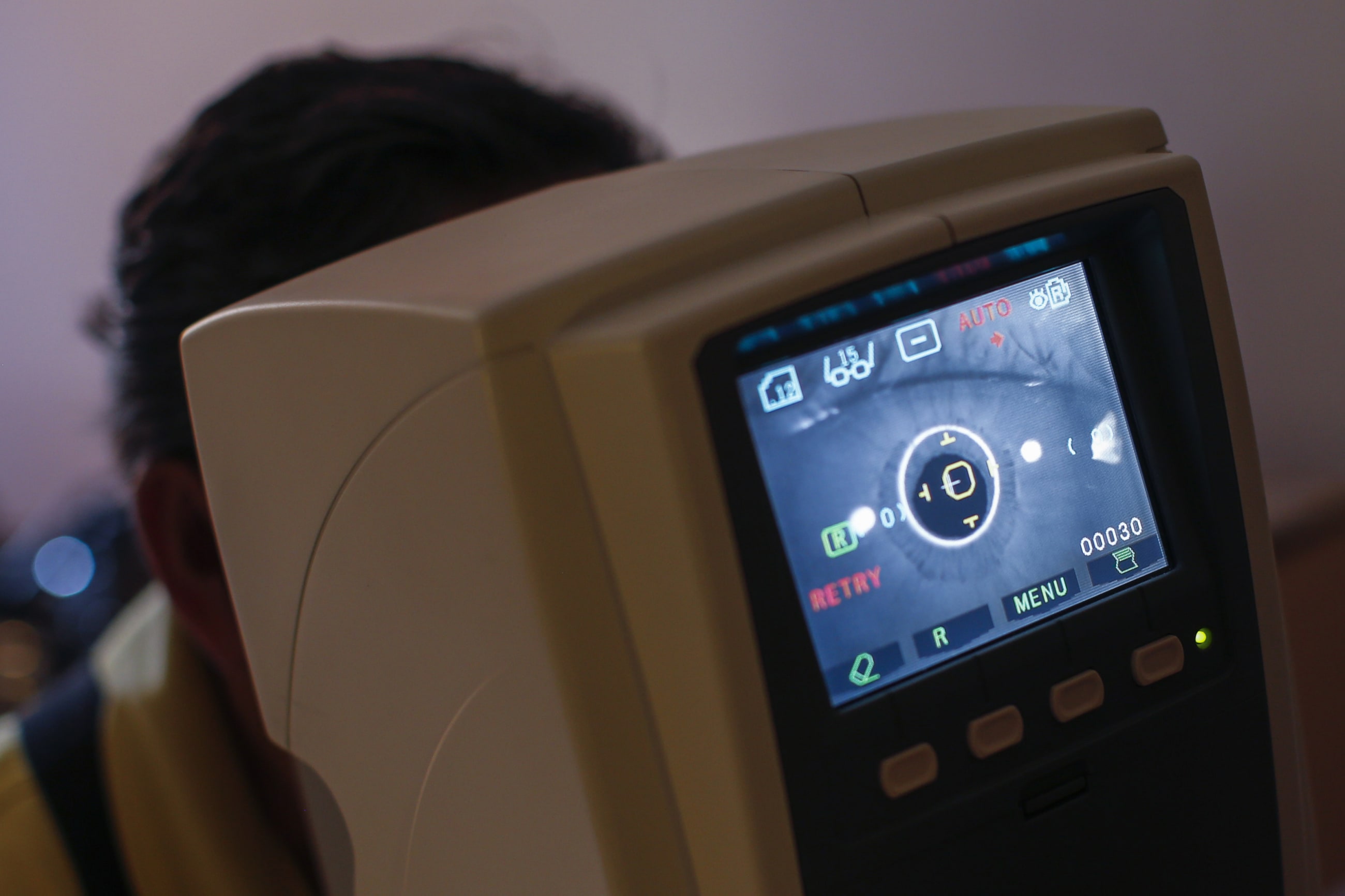 A man has a vision test done by Remote Area Medical volunteers at a clinic in Mission, Texas, on August 6, 2014.