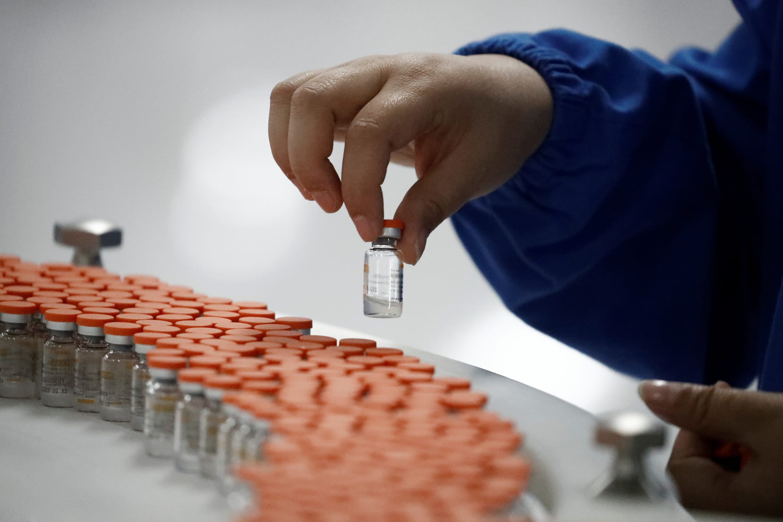 A worker performs a quality check in a Sinovac Biotech packaging facility during the development if an experimental COVID-19 vaccine, in Beijing, China, on September 24, 2020.