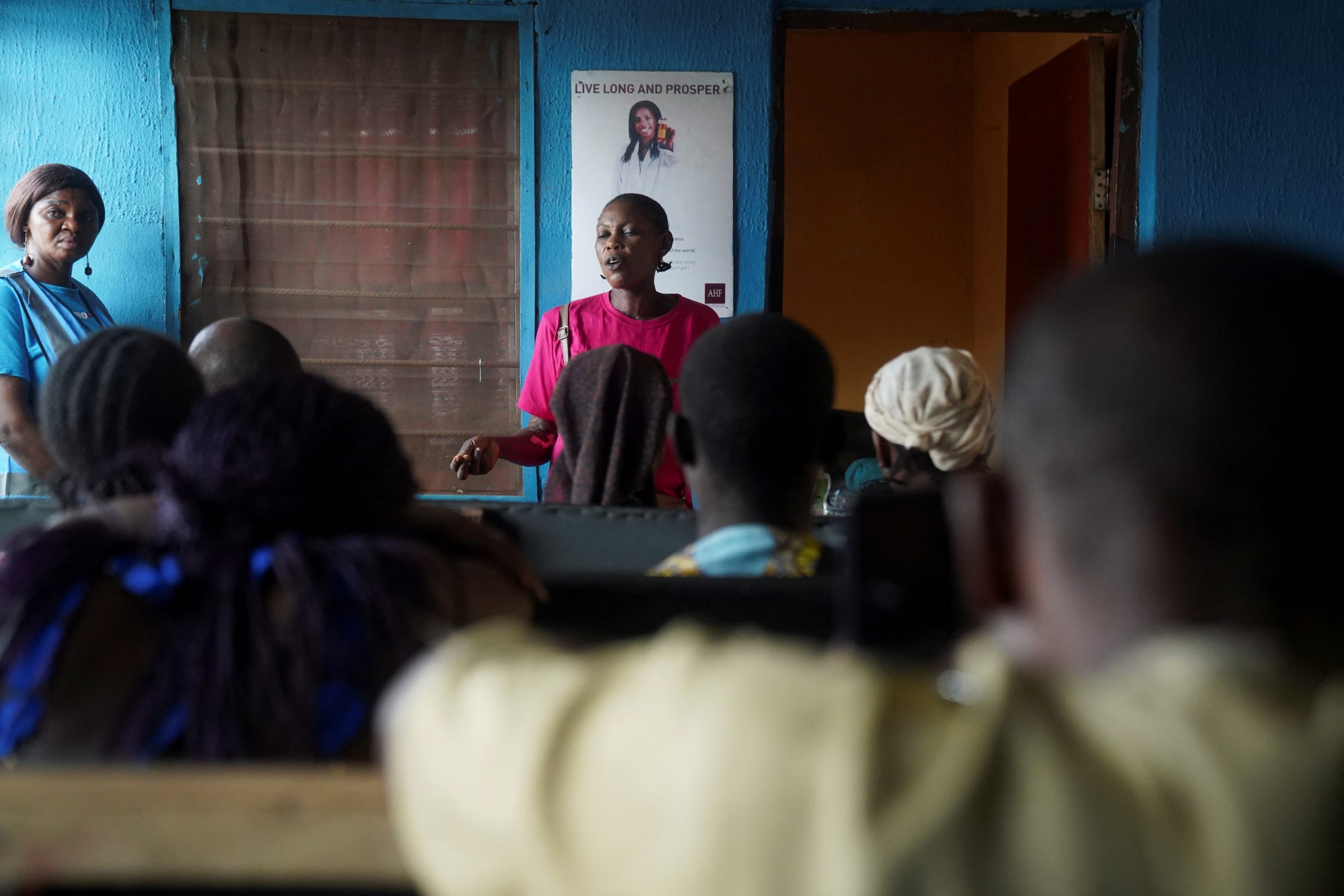 A HIV advocate with African Community Advisory Board talks to patients at a Family Support Clinic, in Agan, Makurdi, Nigeria, on February 12, 2026.
