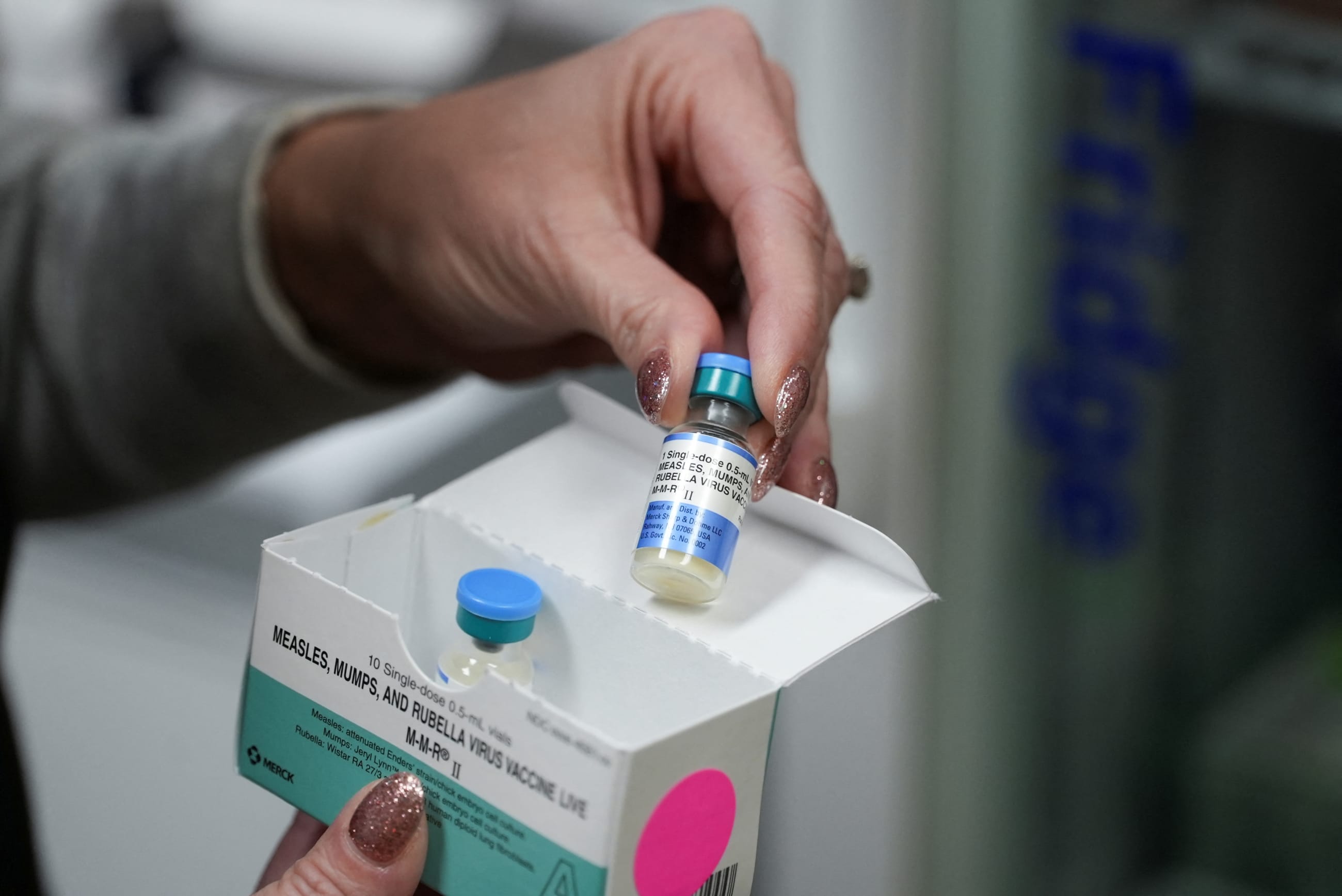 A pediatrician at Tiger Pediatrics holds an MMR vaccine, in Easley, South Carolina, on February 6, 2026.
