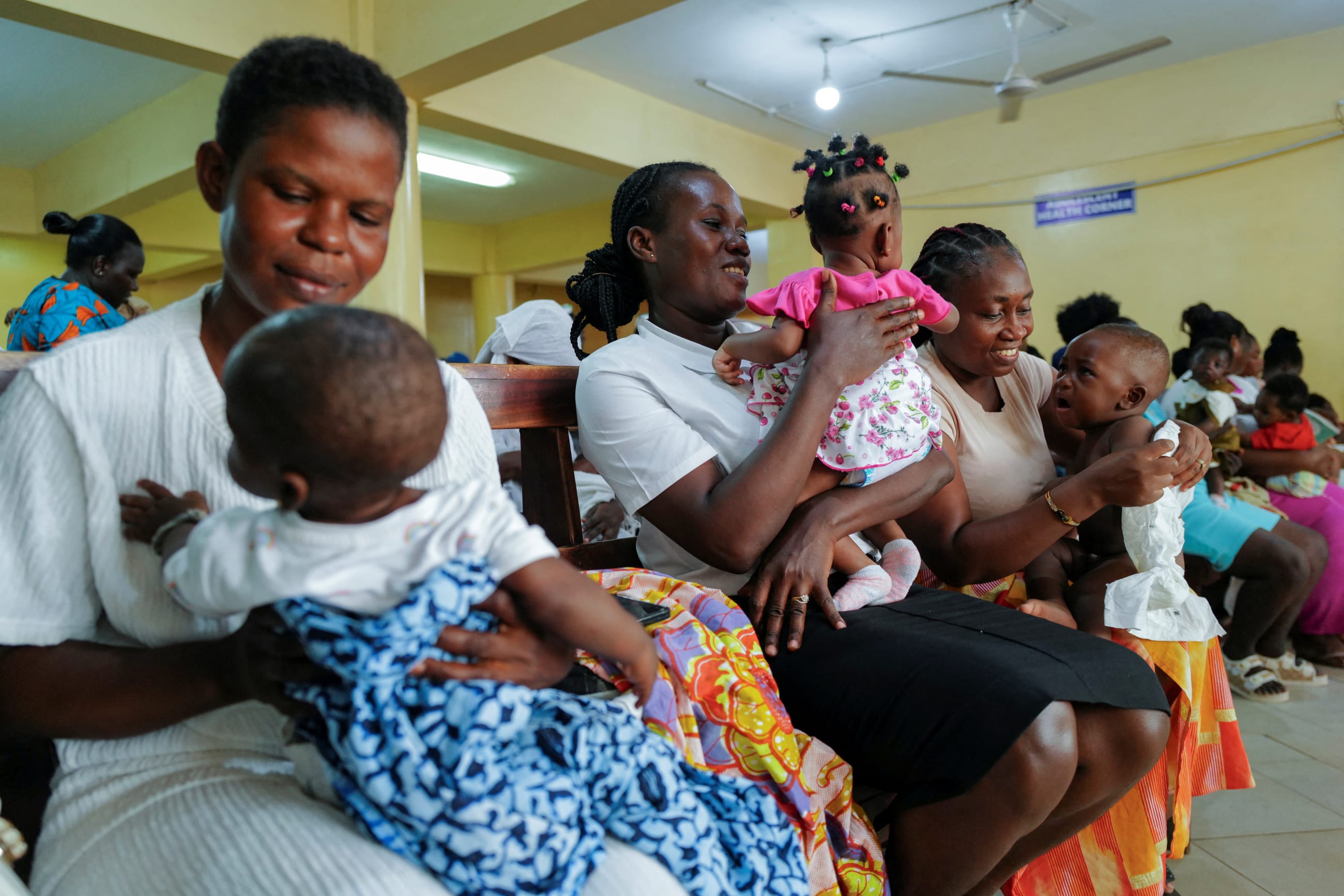 Mothers attend a child welfare clinic at the Mother and Child Hospital, in Kasoa, Ghana, on November 19, 2025.