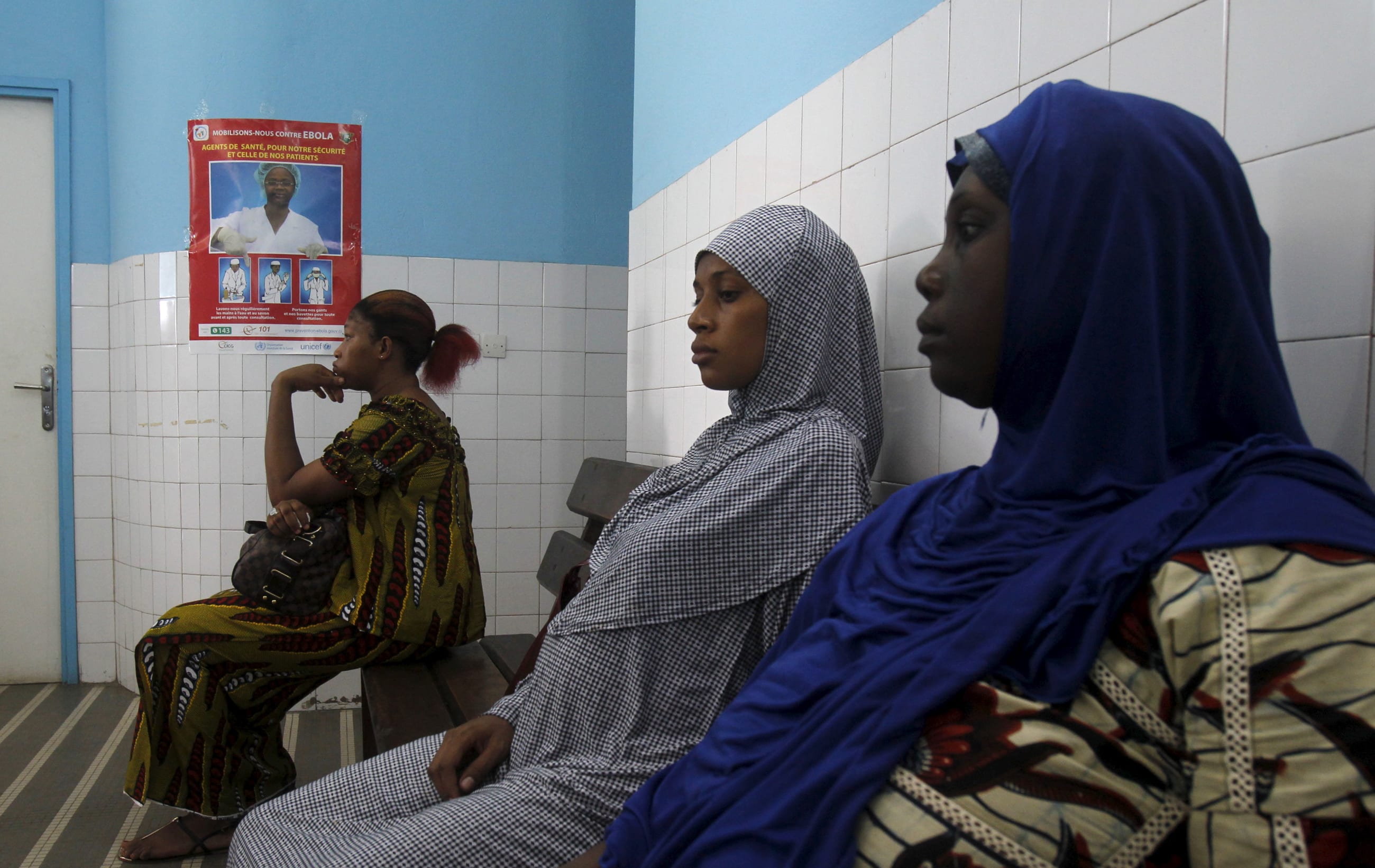 Women sit at a maternity hospital, in Treichville, Abidjan, Ivory Coast, on May 28, 2015.