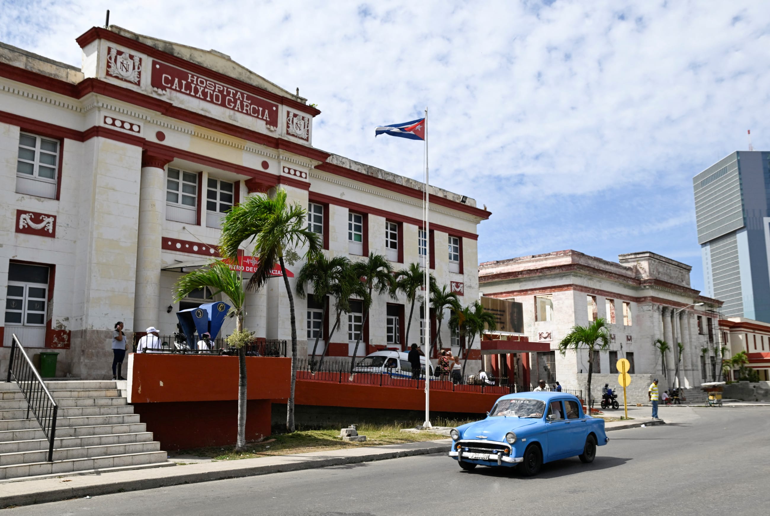 A vintage car passes by the Calixto Garcia hospital as Cuba's once-vaunted healthcare system has deteriorated amid years of economic crisis and U.S. sanctions, in Havana, Cuba, on March 24, 2026.