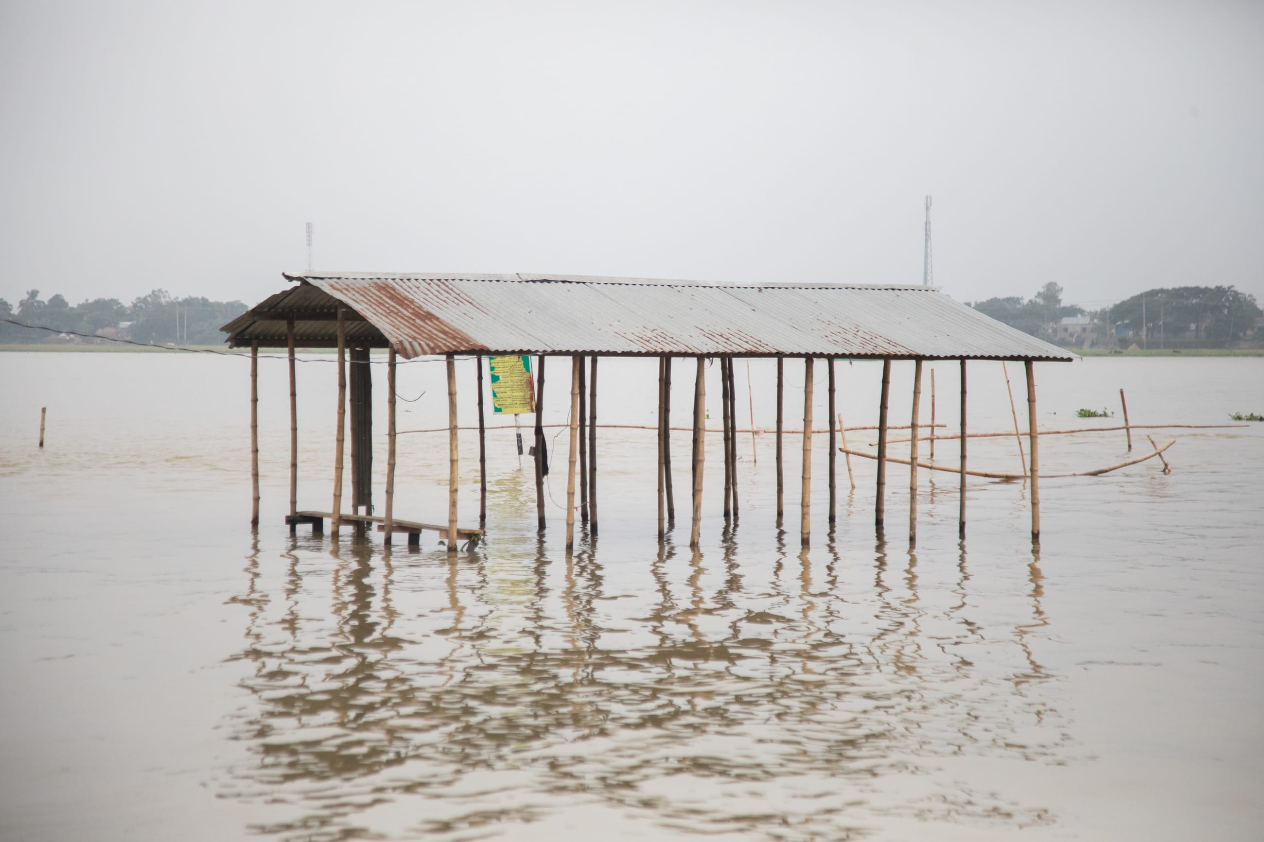 A tea stall stands submerged in floodwaters , in Kishoreganj, Bangladesh, on May 21, 2026.
