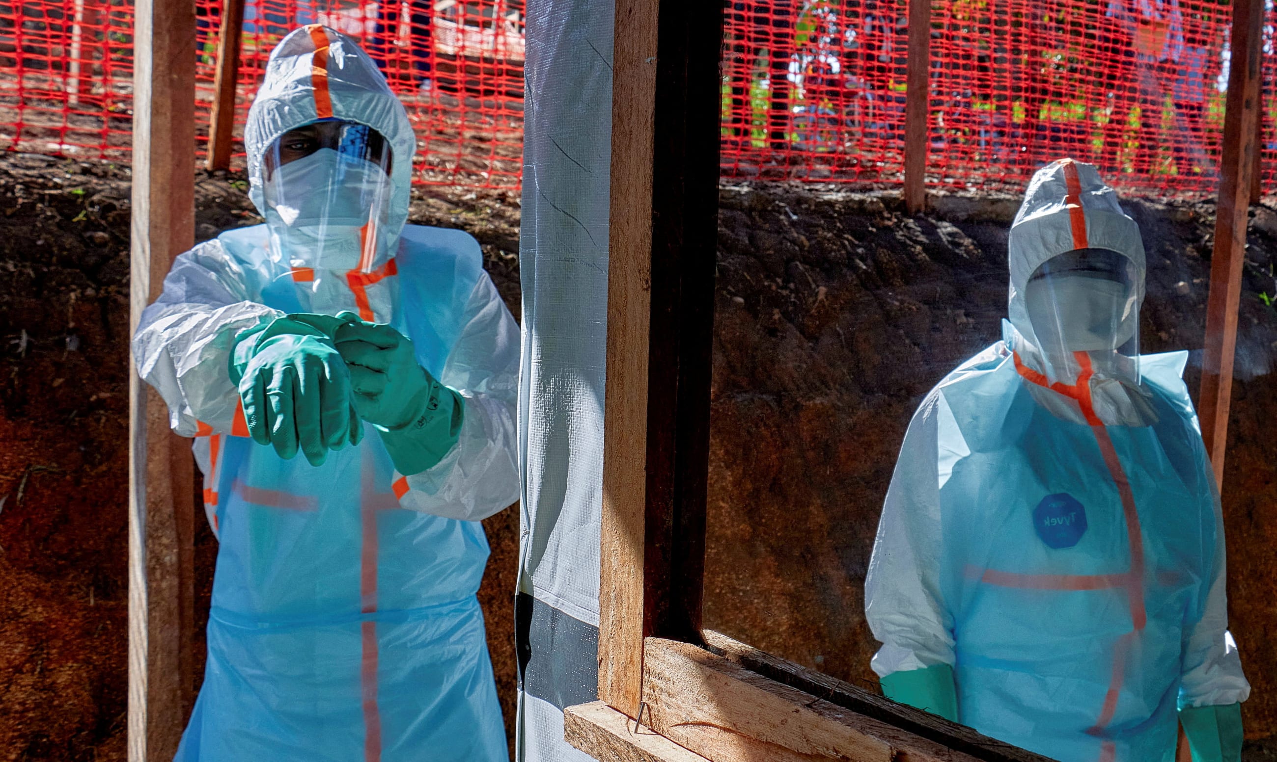 Health workers get dressed in personal protective equipment (PPE) at the Evangelical Medical Center, one of the facilities at the forefront of the response to the Ebola outbreak, as agencies intensify efforts to contain a new Ebola outbreak caused by the Bundibugyo virus strain, in Bunia, Ituri province, Democratic Republic of Congo, May 31, 2026. REUTERS/Gradel Muyisa Mumbere/File Photo