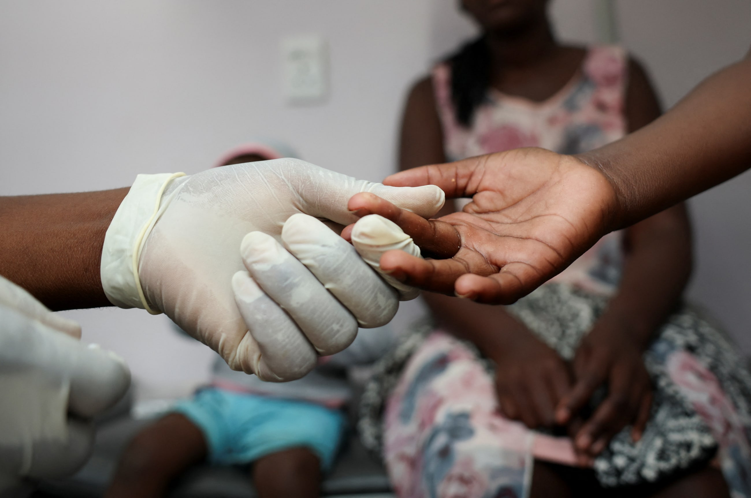 A nurse takes a blood sample for an HIV test, in Diepsloot, South Africa, on March 12, 2025.