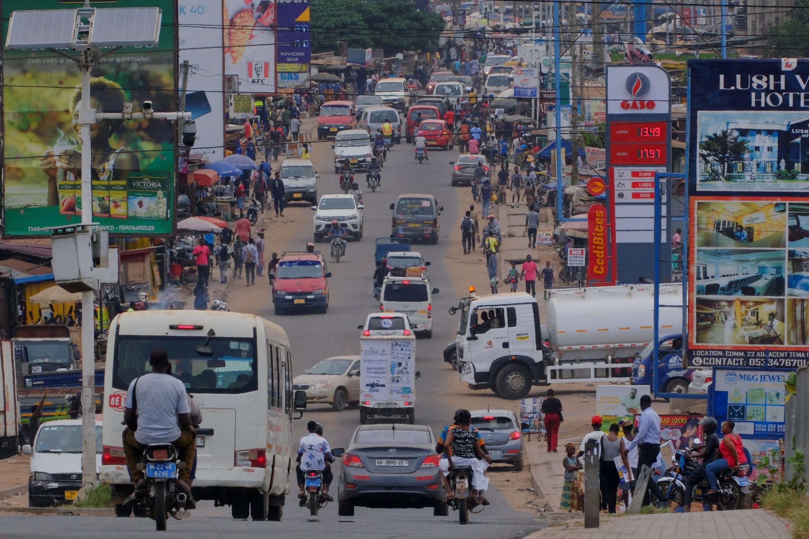 Displays show the prices of petrol and diesel near a street in Tema, Ghana, on April 1, 2026.