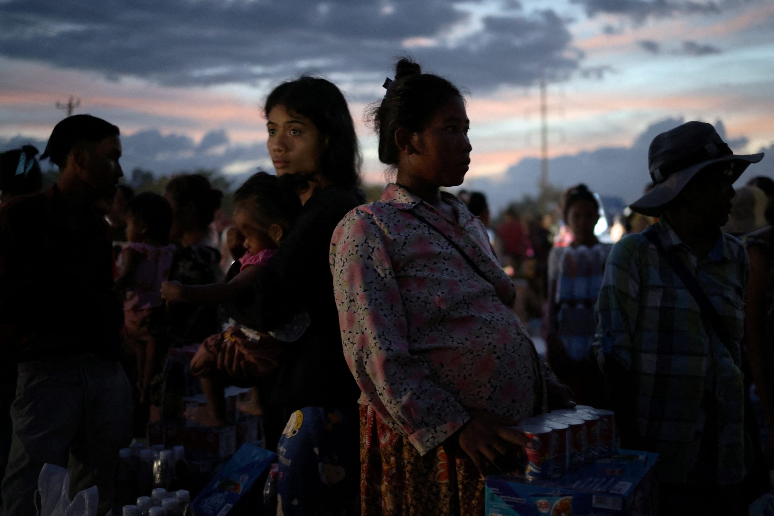 Suang Sreang, 27, who is pregnant waits to receive supplies at Wat Por Sovannaram refugee camp, in Ou Chrov district, Banteay Meanchey Province, Cambodia, on December 13, 2025