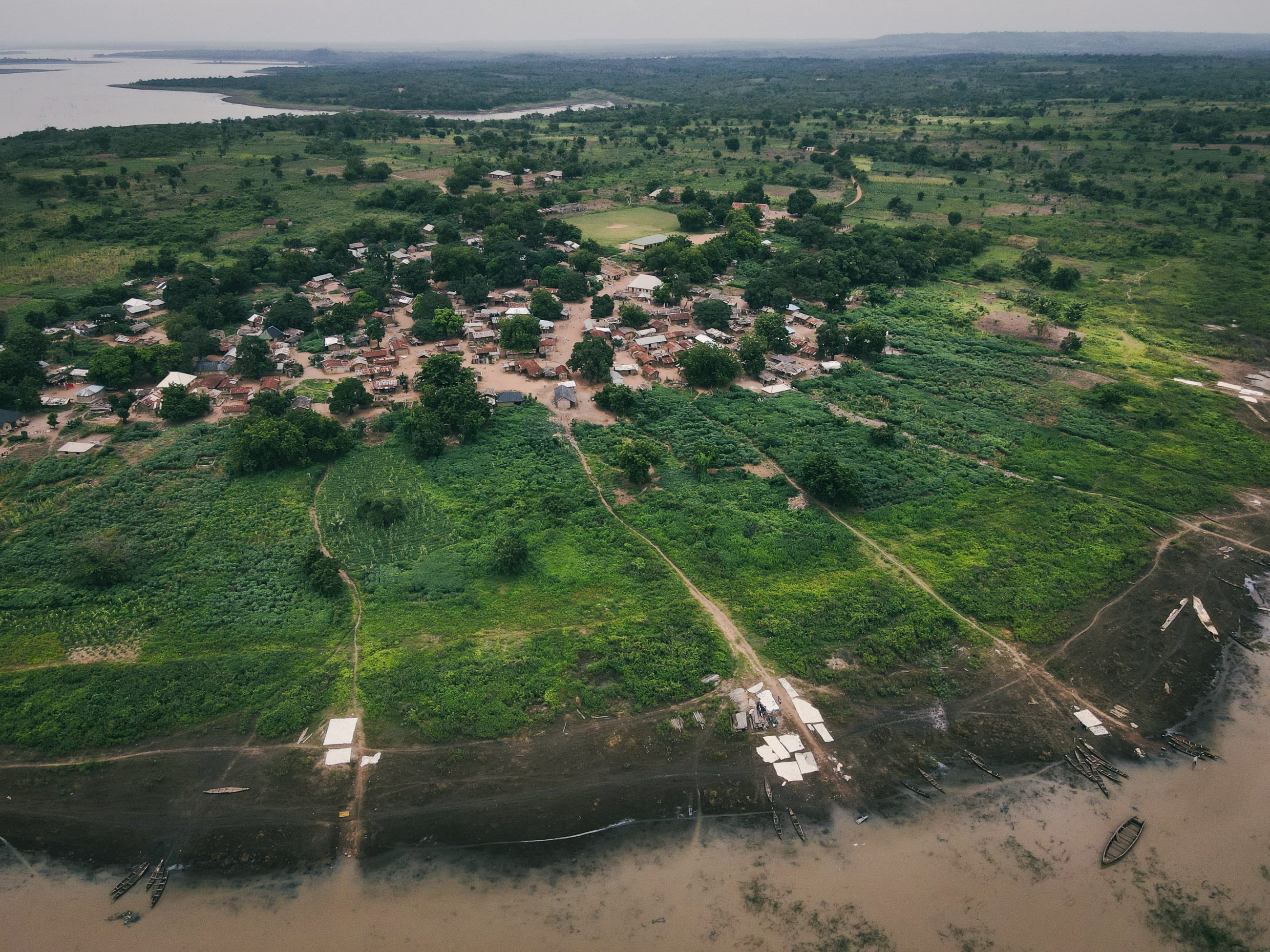 Imala Odo, Nigeria, and the Oyan River, are seen, photographed with drone, on July 2025.