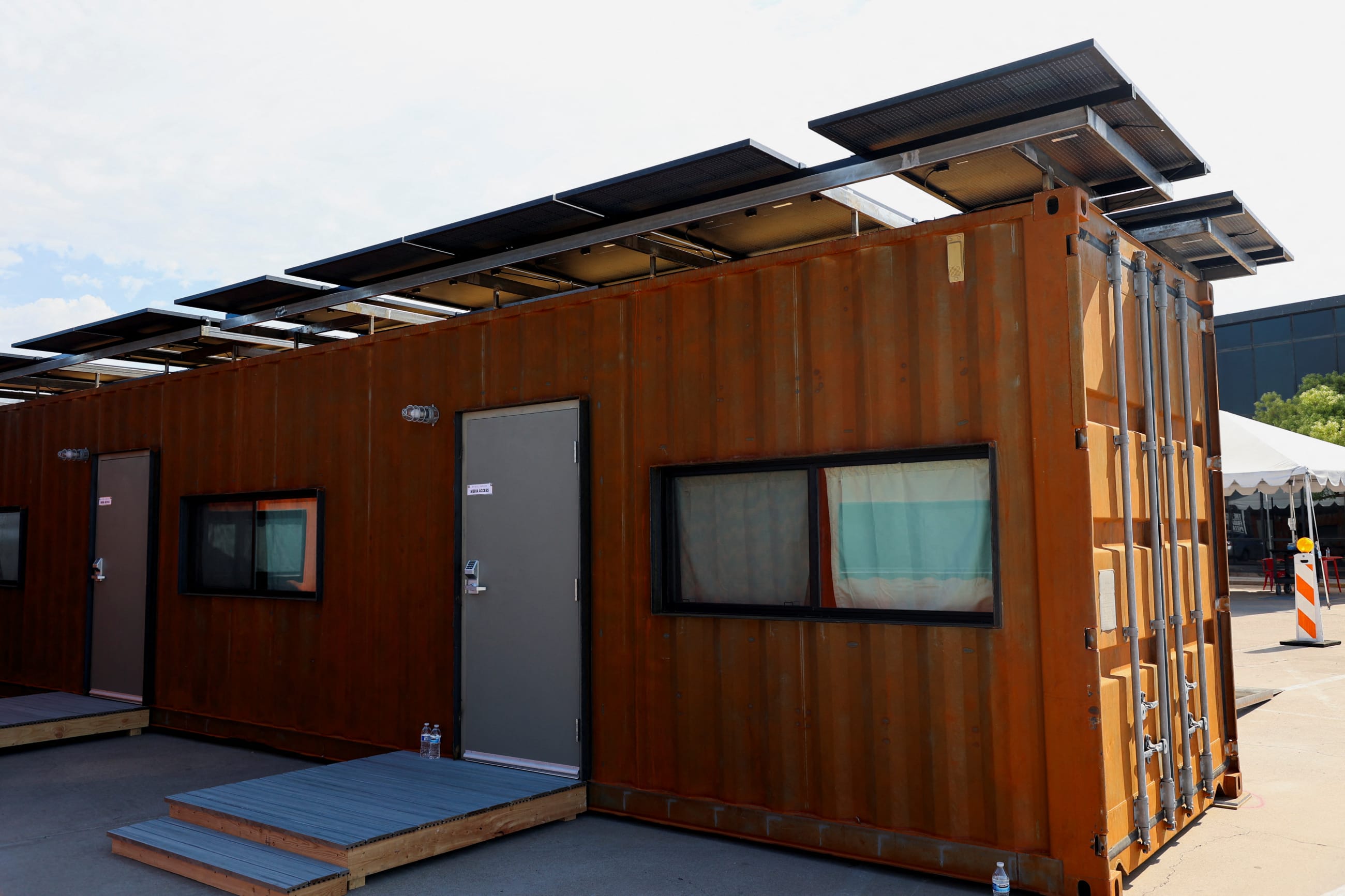 Shipping containers turned into shelters for the homeless are seen, in Phoenix, Arizona, on July 27, 2023.