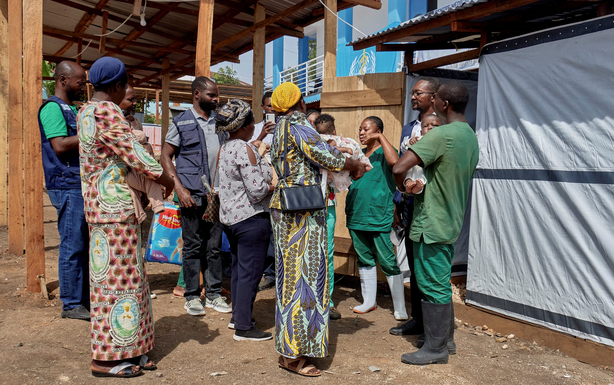 Congolese nuns receive children cleared of Ebola from Saint Nicholas Orphanage, at the Centre Medical Evangelique within the secured Ebola response zone, as aid agencies intensify efforts to contain the Ebola outbreak involving the Bundibugyo strain, in Hoho commune of Bunia town, Ituri province, Democratic Republic of Congo, on June 9, 2026.