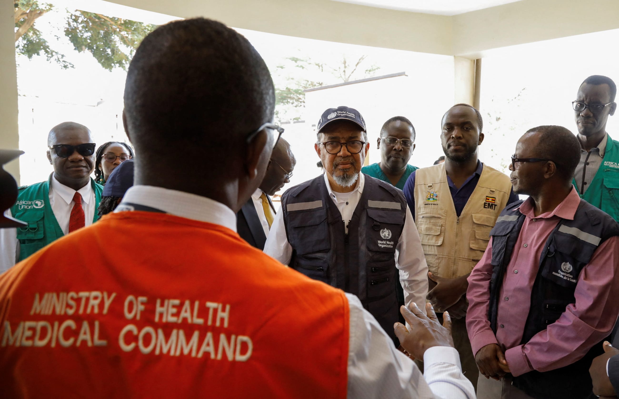 Director General of the World Health Organization Tedros Adhanom Ghebreyesus, talks to Ugandan medical workers during his visit at the Mulago National Referral Hospital Isolation Unit, as aid agencies intensify efforts to contain a new Ebola outbreak involving the Bundibugyo Virus, in Mulago suburb, of Kampala, Uganda, on June 8, 2026.