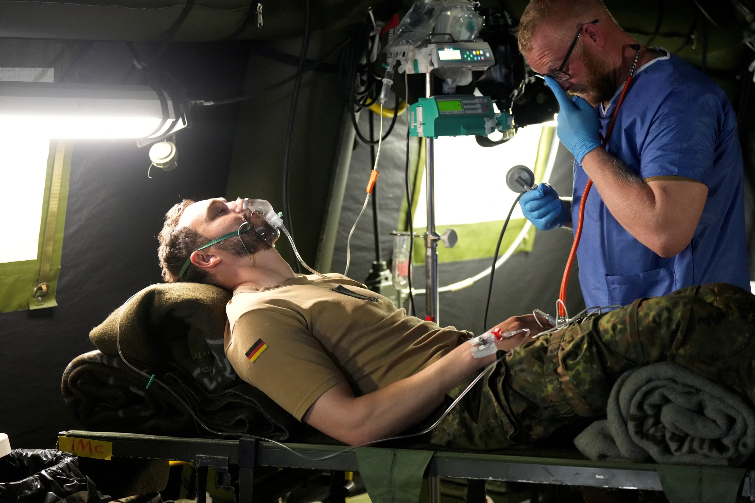 A military medic performs in the field intensive care unit tent during the NATO Quadriga 2024 military exercise, in Pabrade, Lithuania, on May 29, 2024.