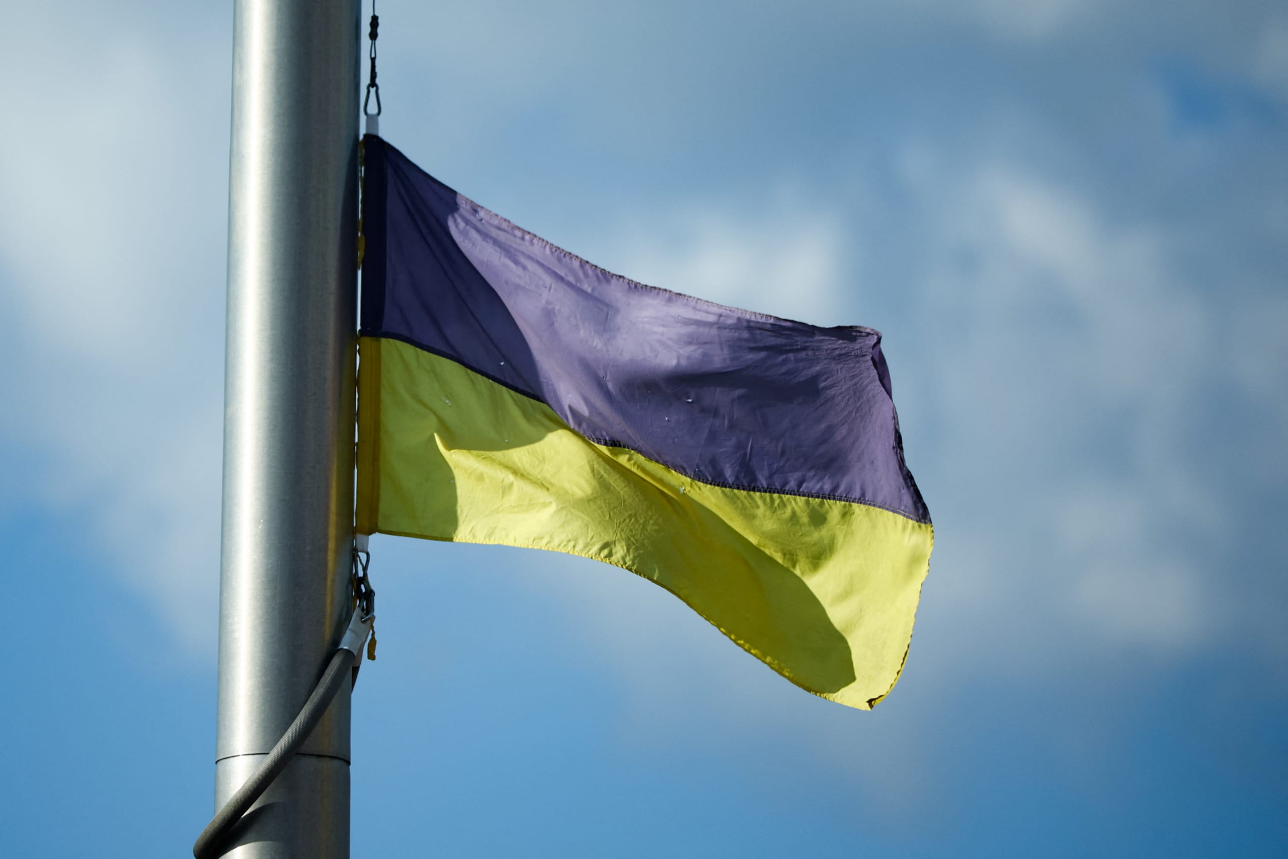 A view of a Ukrainian flag from the frontline of the war with Russia is delivered by activists, on the sidelines of a NATO leaders summit, in Vilnius, Lithuania, on July 11, 2023.