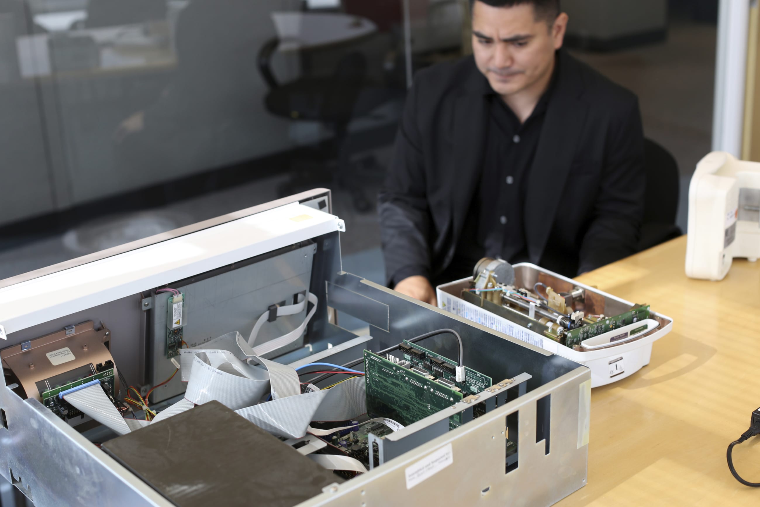 Cybersecurity researcher Billy Rios looks over a Pyxis medical supply dispenser and an infusion pump, which controls the flow of intravenous drugs into hospital patients, in Redwood City, California, on October 10, 2014.