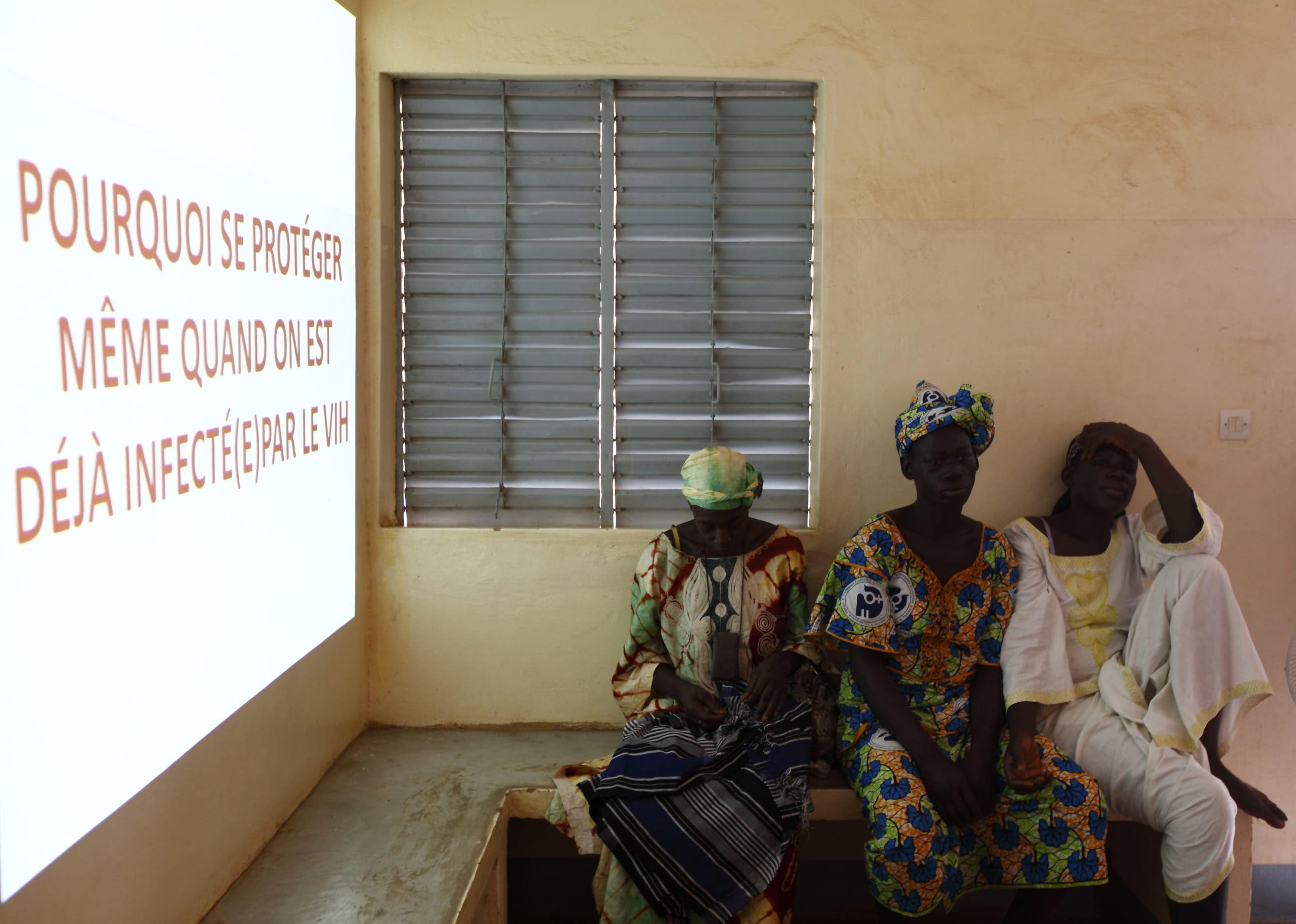 Women attend a talk on sexual health at the Association of Solidarity, Life and Health welcome center and clinic, in the Tanghin neighborhood of Ouagadougou, Burkina Faso, on April 13, 2013.