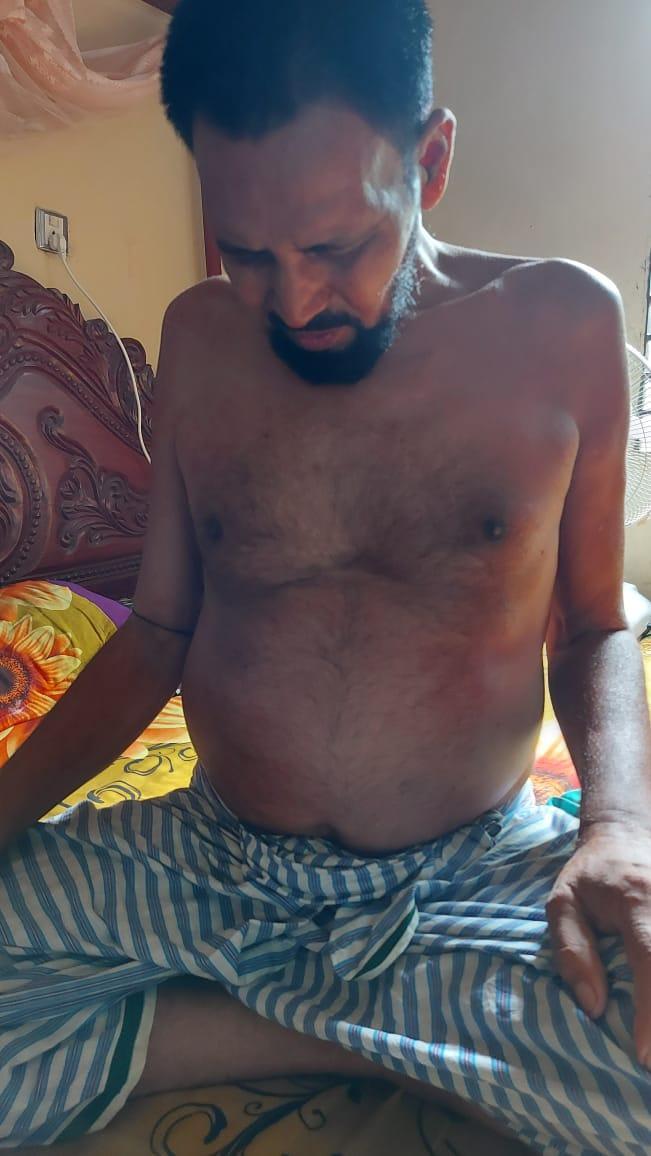 Ibrahim Mia, sitting in his home in Cumilla, Bangladesh. Photo taken on June 18, 2022.