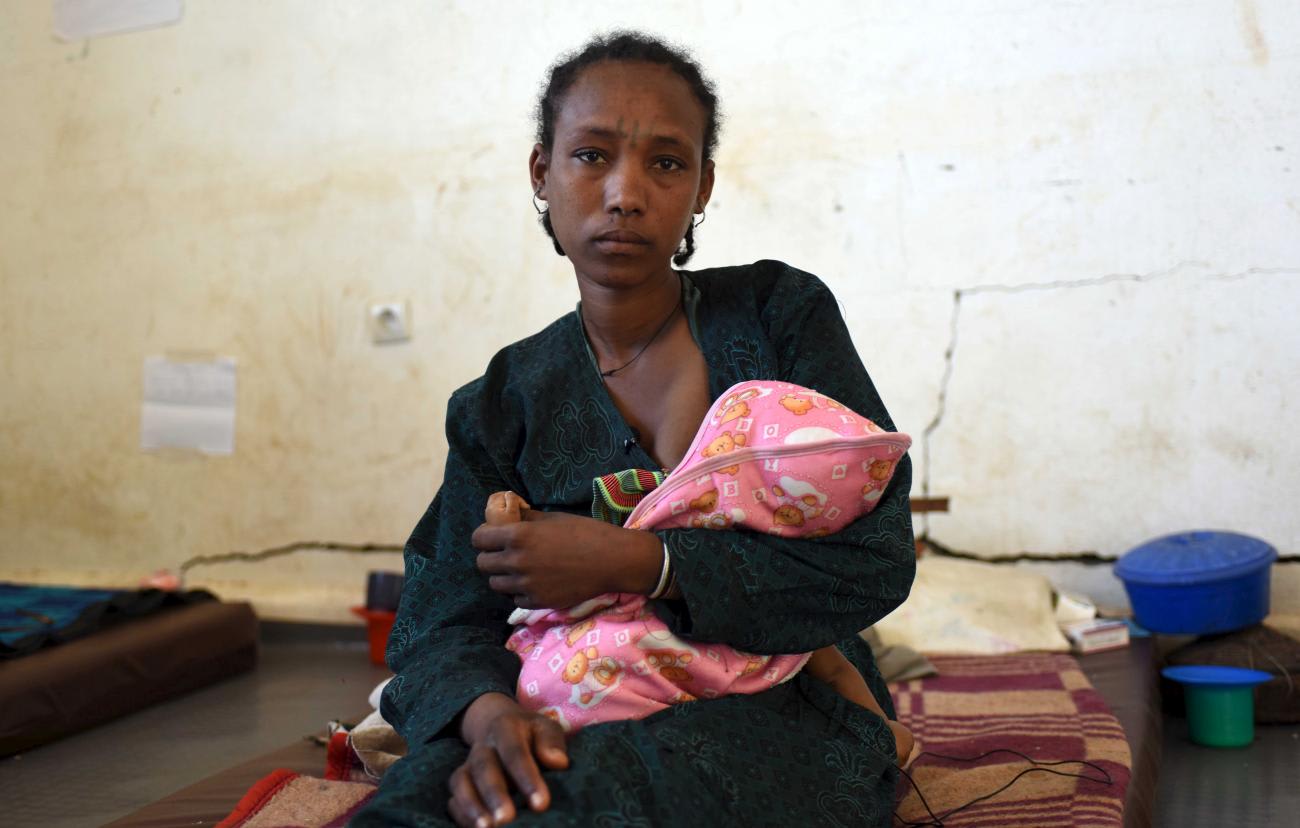 A woman breastfeeds her baby in Seriel Health Center in Ethiopia's northern Amhara region on February 13, 2016.