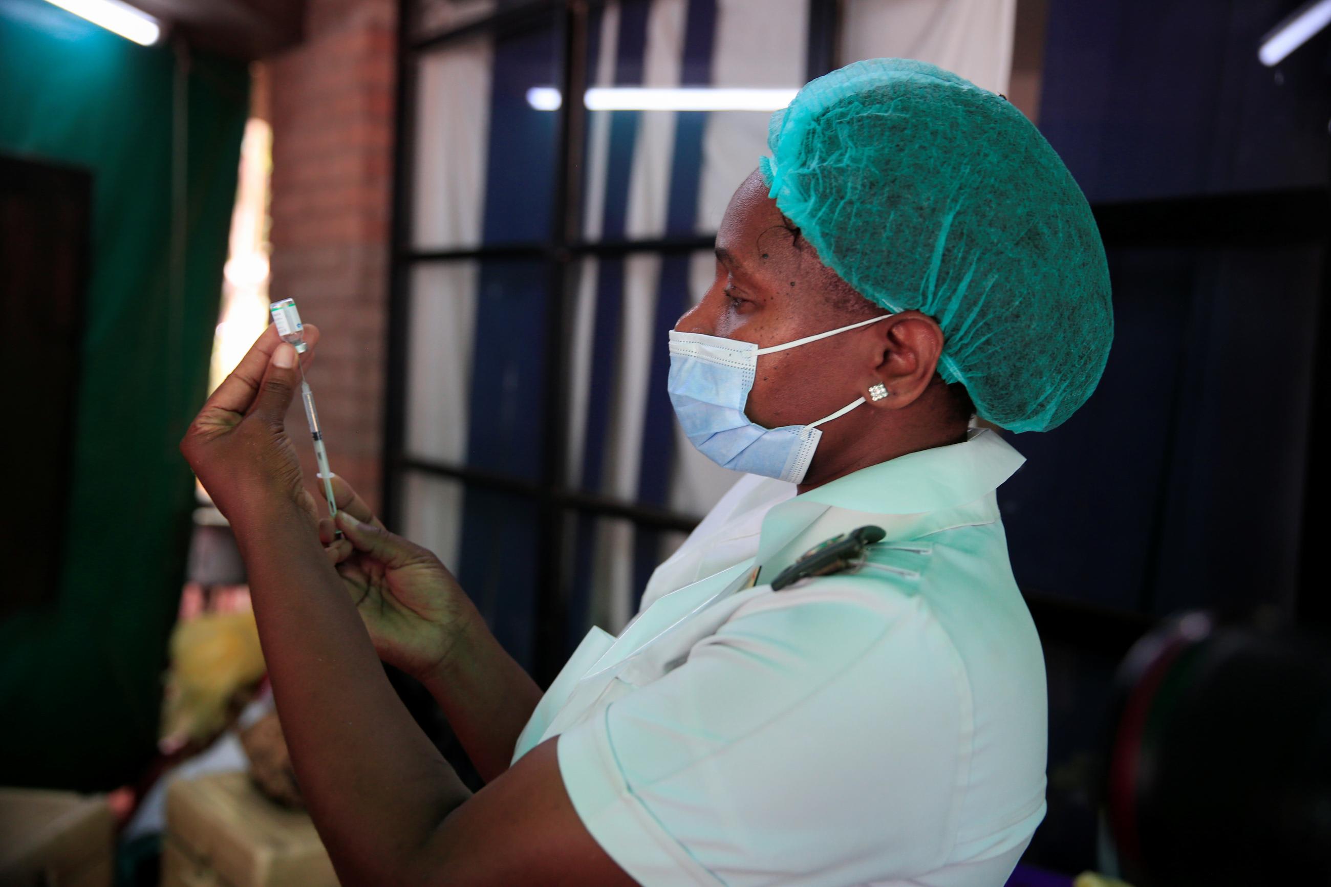 A nurse prepares a dose of the Sinopharm coronavirus (COVID-19) vaccine at Wilkins Hospital in Harare, Zimbabwe, March 24, 2021.