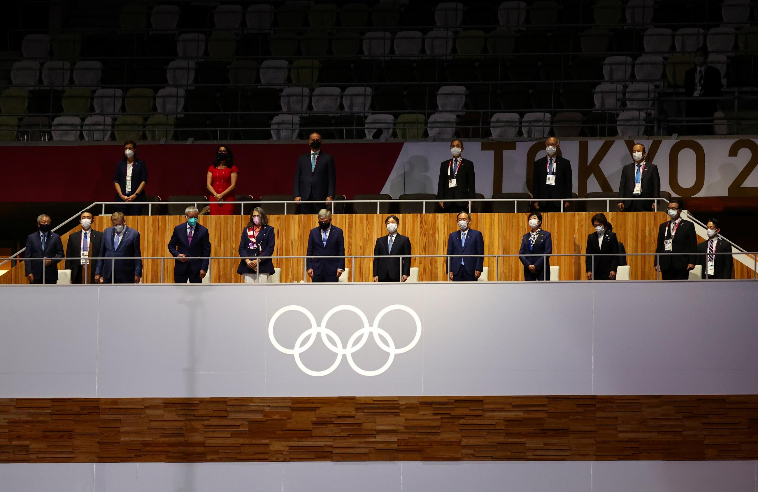 International Olympic Committee (IOC) President Thomas Bach, Japan's Emperor Naruhito and Japanese Prime Minister Yoshihide Suga are pictured wearing protective face masks during the opening ceremony
