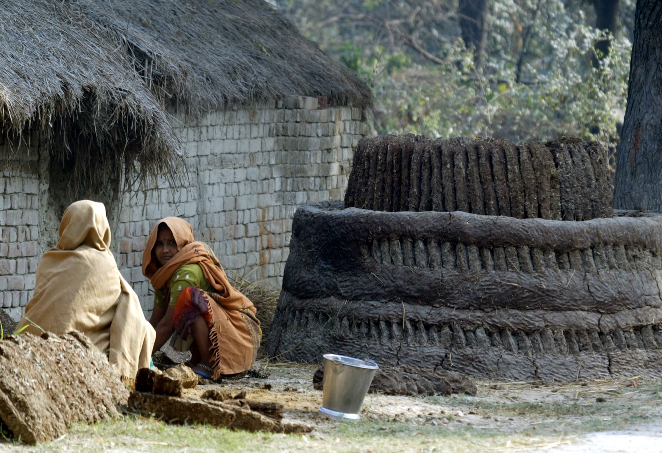 Dalit women work outside, in Lucknow, India, on January 16, 2008.