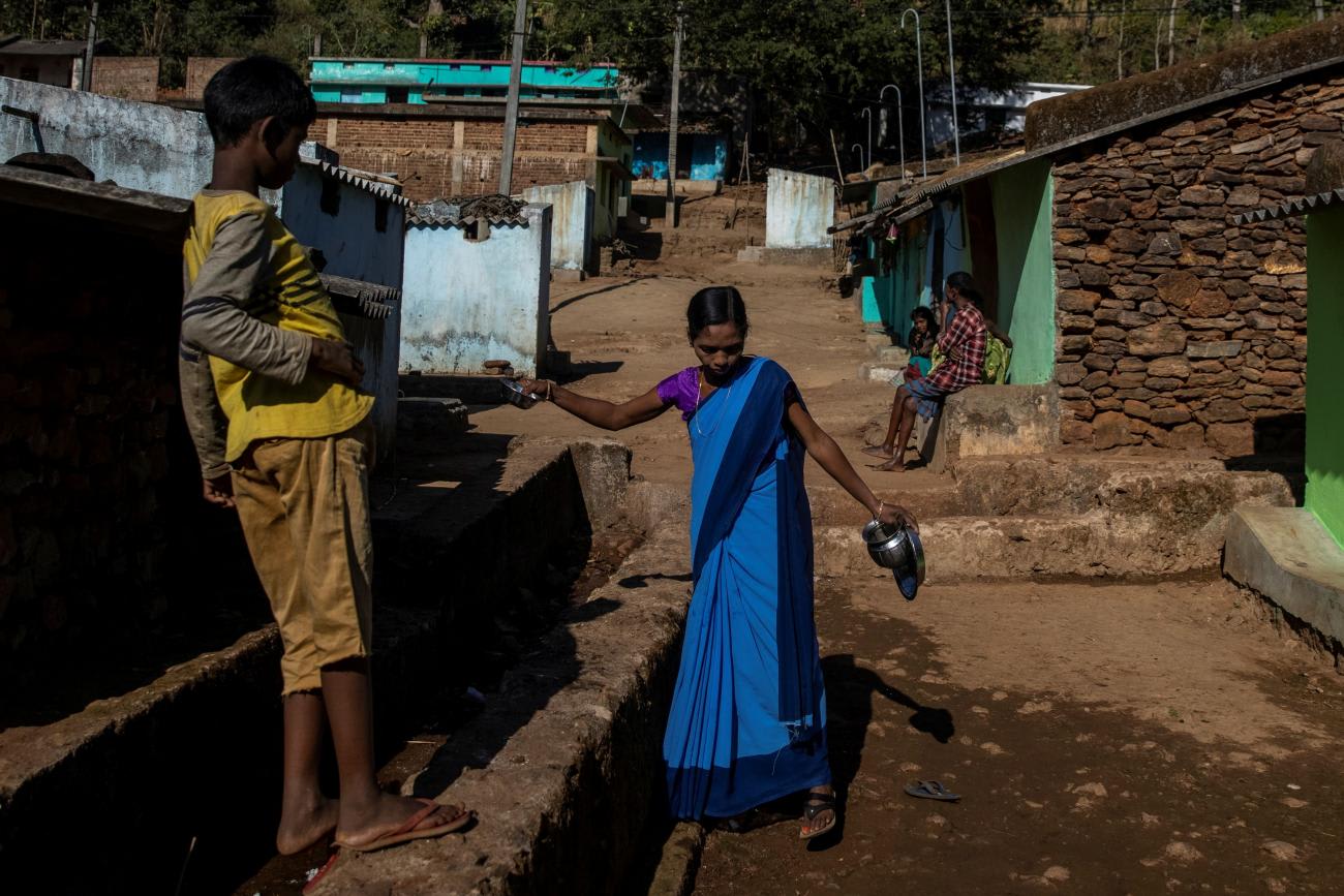 An ASHA health worker, washes her utensils before travelling to Mathalput Community Health Centre to receive the vaccine developed by Oxford/AstraZeneca, in Koraput, India, on January 16, 2021.