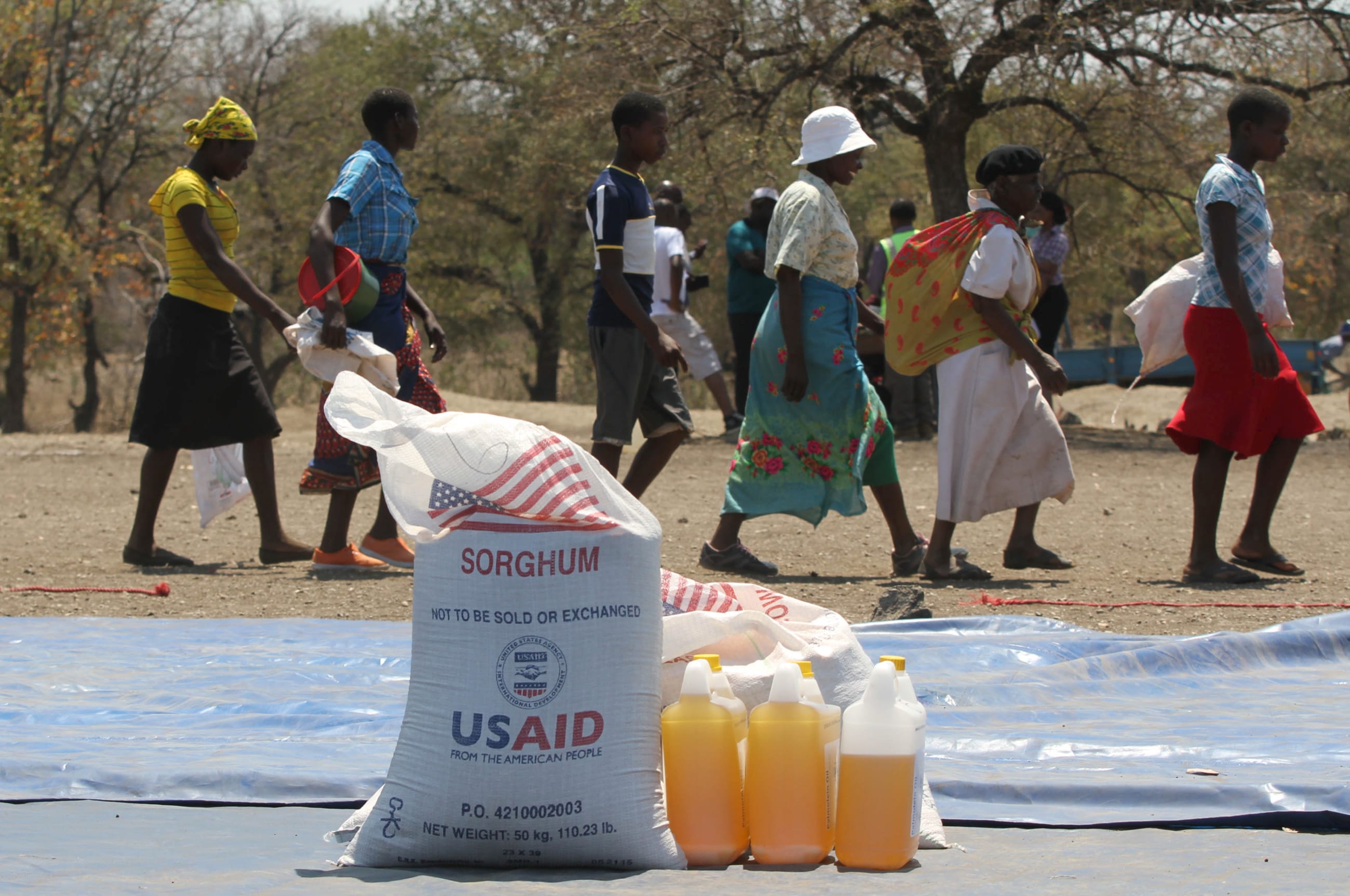 Women arrive to collect their monthly food rations sourced by World Food Program (WFP), in the rural areas of Mupinga, Chiredzi, Zimbabwe, on October 6, 2015.