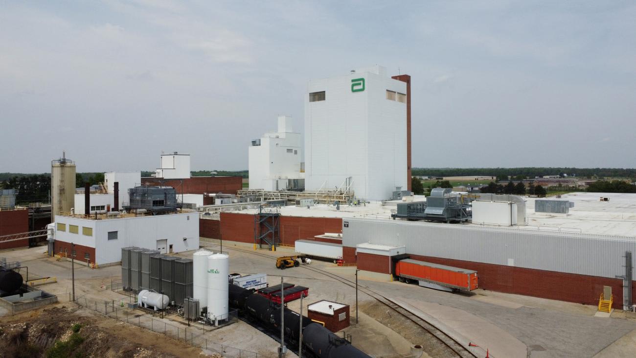 a drone image shows the Abbott Laboratories facility, an white industrial building, where dozens of recalled types of powdered baby formulas were made, leading to production being halted at the location, in Sturgis, Michigan, on May 20, 2022.