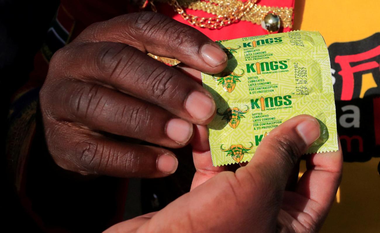 Stanley Ngara, also known as African King of Condoms, distributes condoms to people, to raise awareness of safe sex in combating the spread of HIV/AIDS, in Nairobi, Kenya, on December 1, 2022.