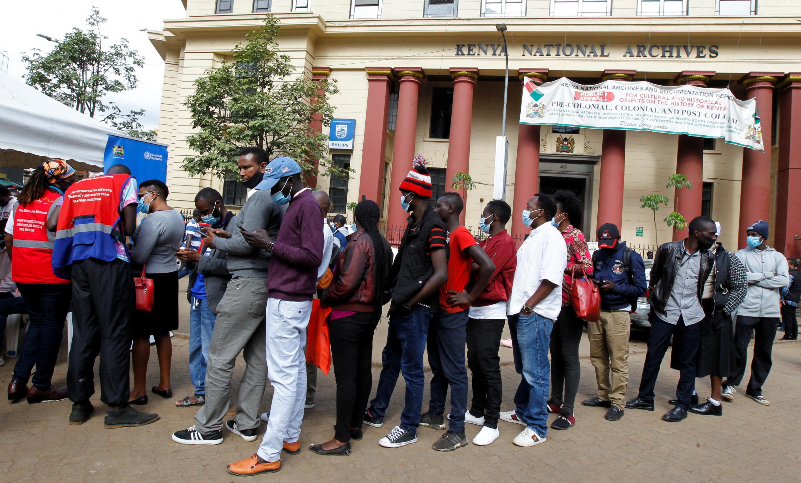Civilians queue to receive the COVID-19 vaccine at a makeshift tent as the government orders for proof of vaccination to access public places and transport, in Nairobi, Kenya, on December 23, 2021202