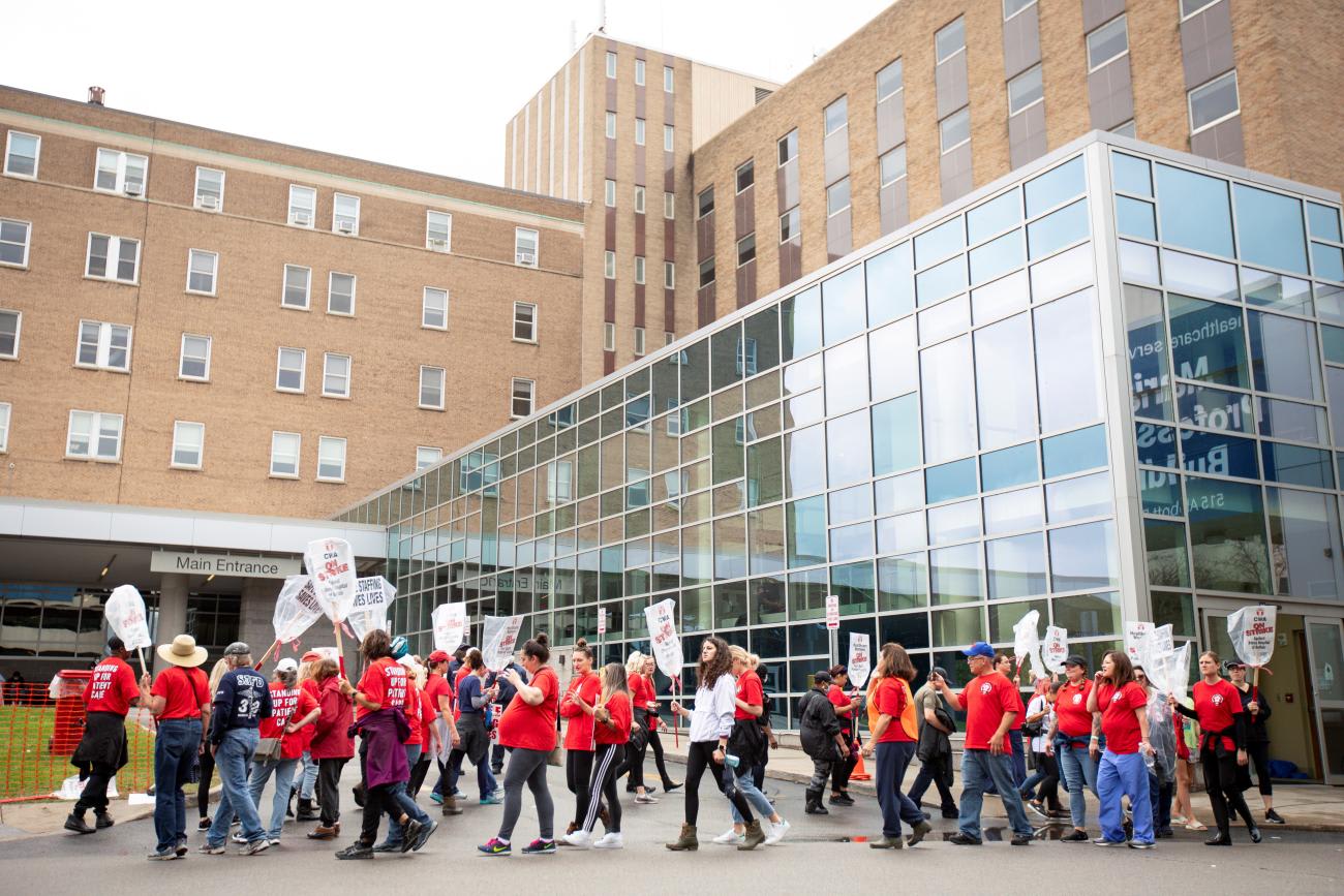 Health-care workers take part in a strike to protest working conditions in hospitals amid COVID-19, at Mercy Hospital in Buffalo, New York, on October 4, 2021.