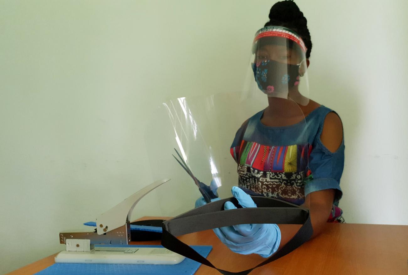 Workers prepare face shields from recycled plastics at the Zaidi Recyclers workshop as a measure to stop the spread of COVID-19 in Dar es Salaam, Tanzania, on May 27, 2020.